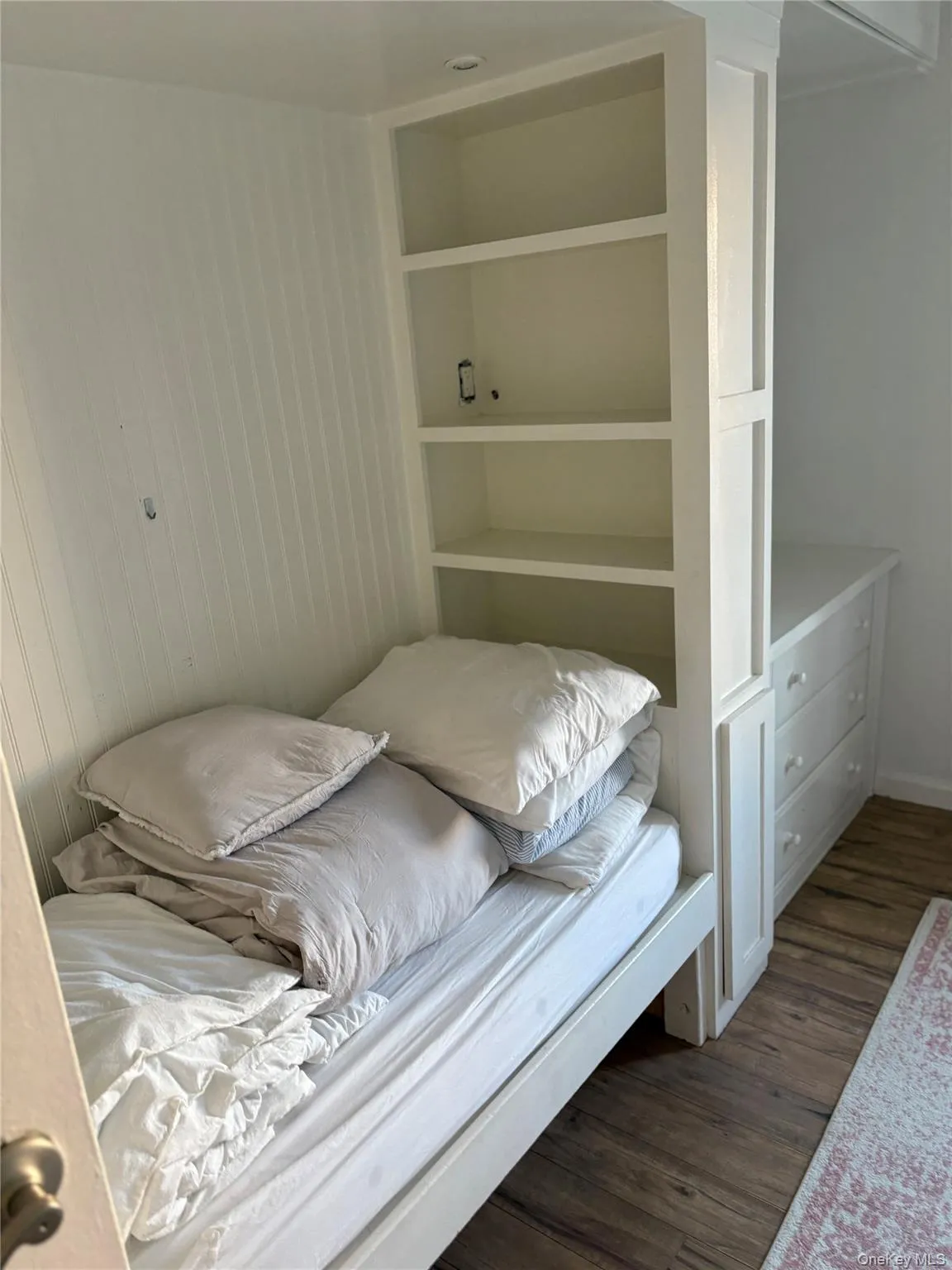 Bedroom featuring dark wood-style floors Bedroom featuring dark wood-style floors