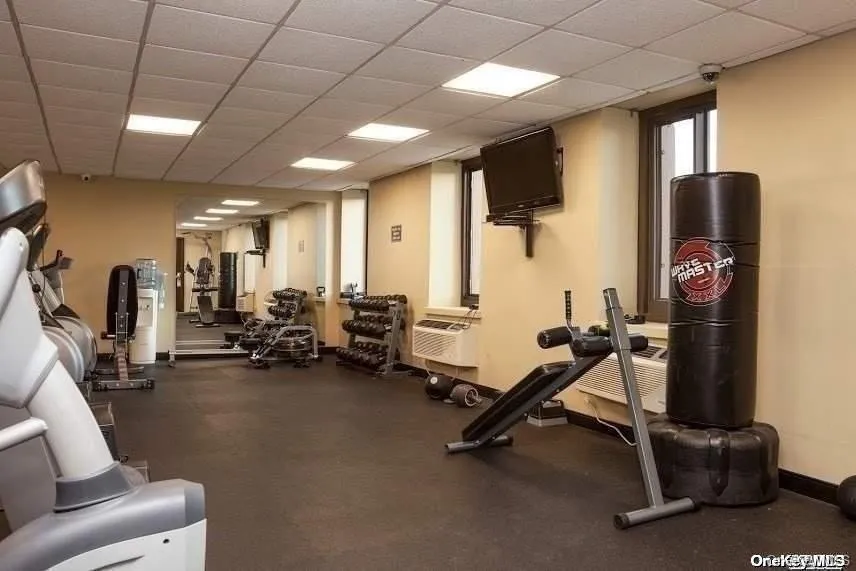 Exercise room featuring a paneled ceiling Exercise room featuring a paneled ceiling