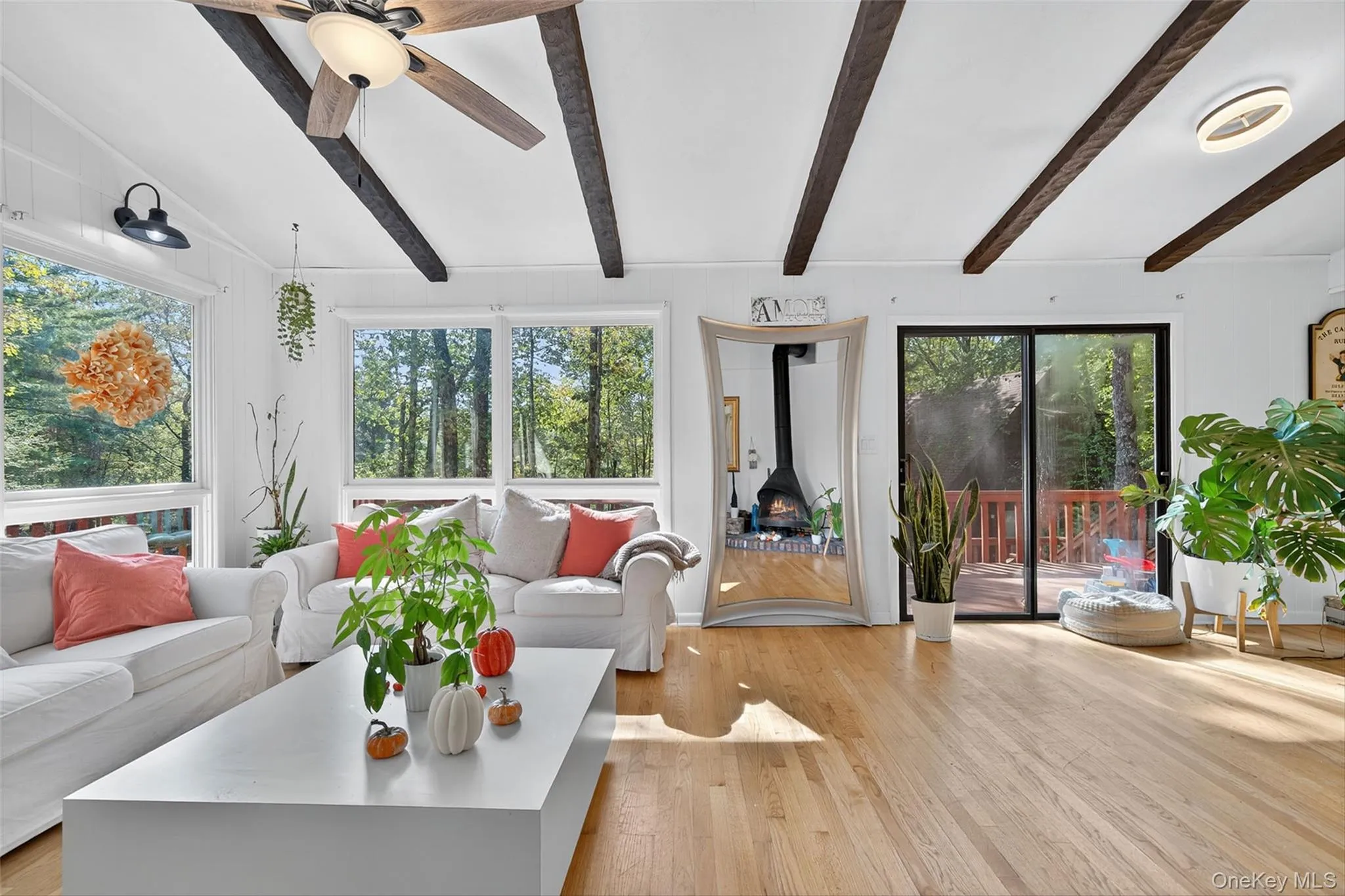 Sunroom / solarium featuring beamed ceiling Sunroom / solarium featuring beamed ceiling