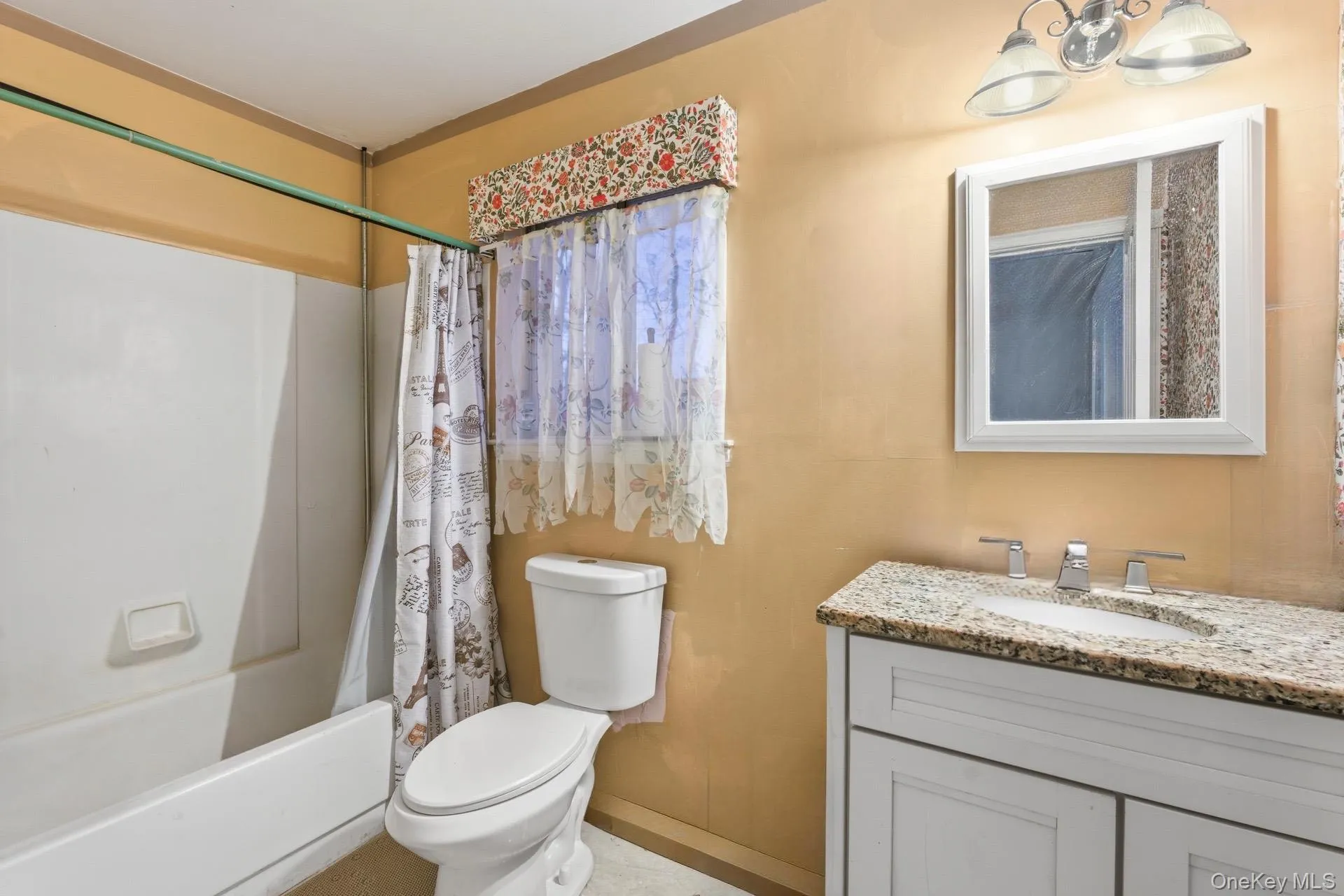 Full bathroom with vanity and shower / tub combo with curtain Full bathroom with vanity and shower / tub combo with curtain