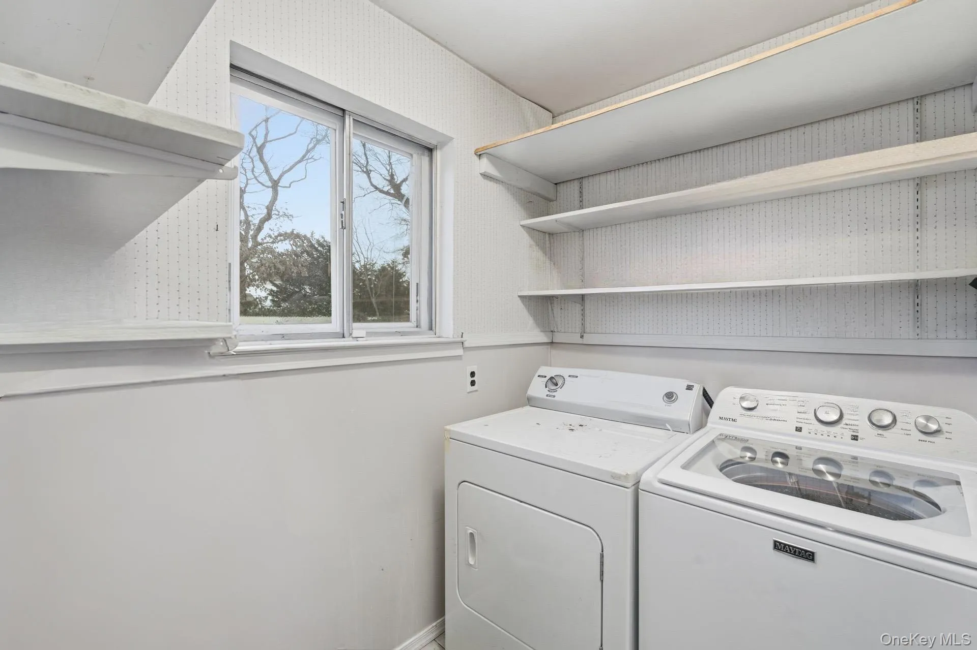 Laundry room with washer and clothes dryer Laundry room with washer and clothes dryer