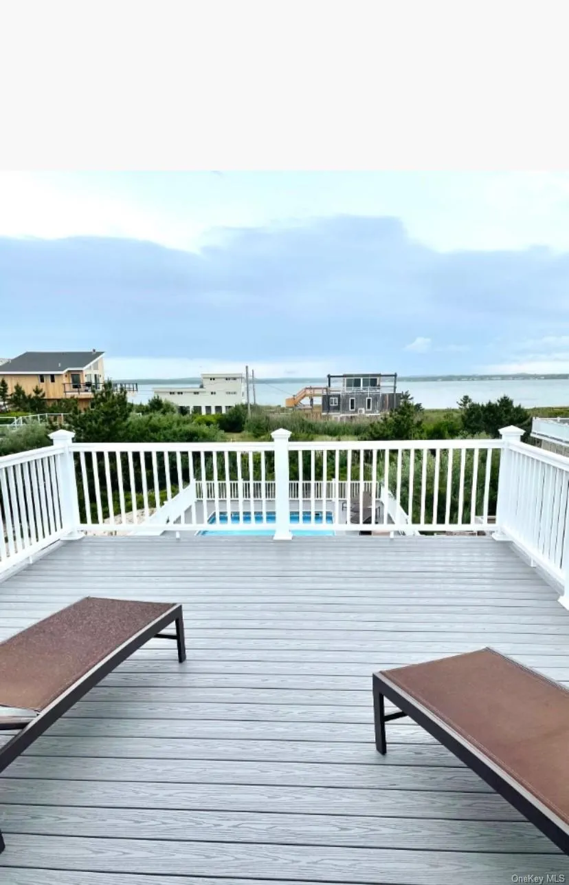 Wooden deck with a water view Wooden deck with a water view