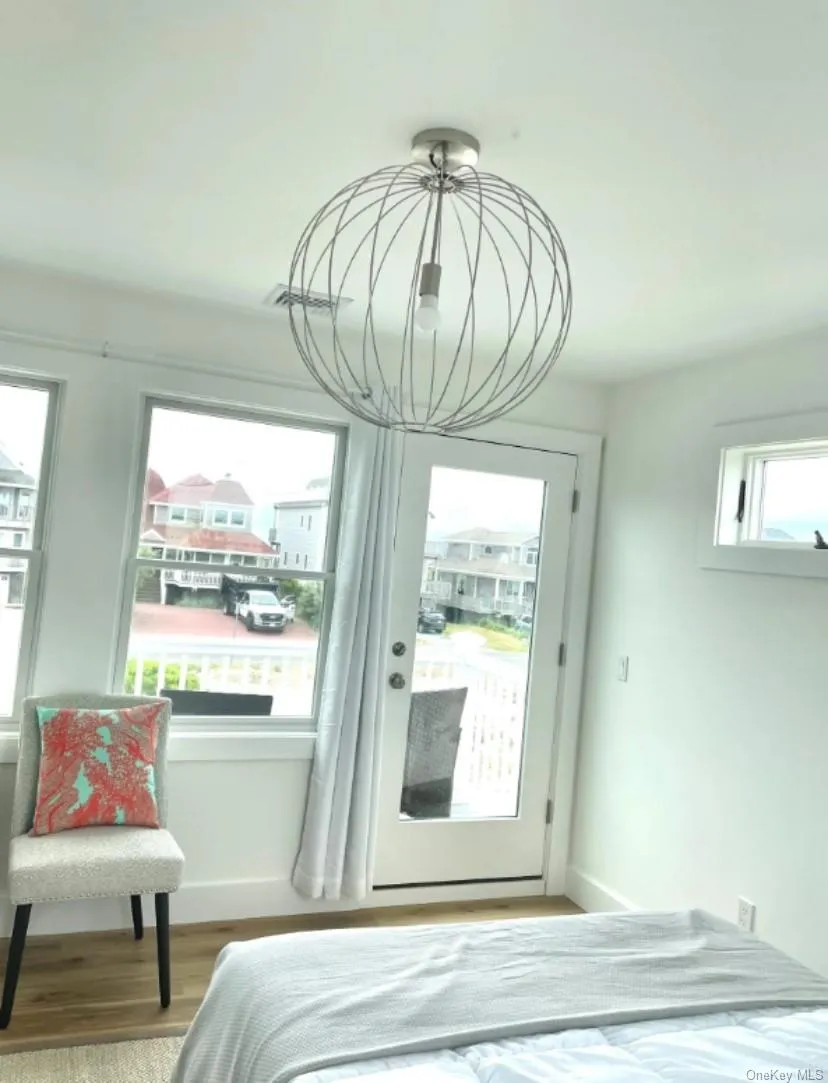 Bedroom with wood finished floors and baseboards Bedroom with wood finished floors and baseboards