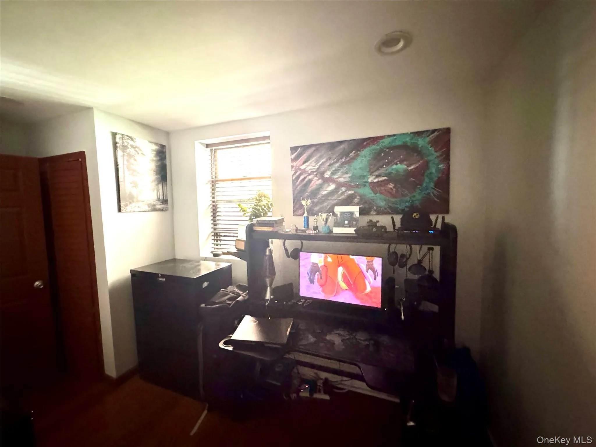 Office with dark wood-style floors Office with dark wood-style floors