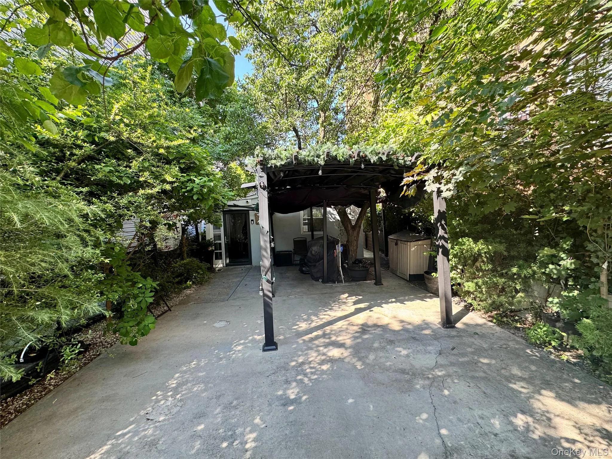 View of patio and front driveway View of patio and front driveway