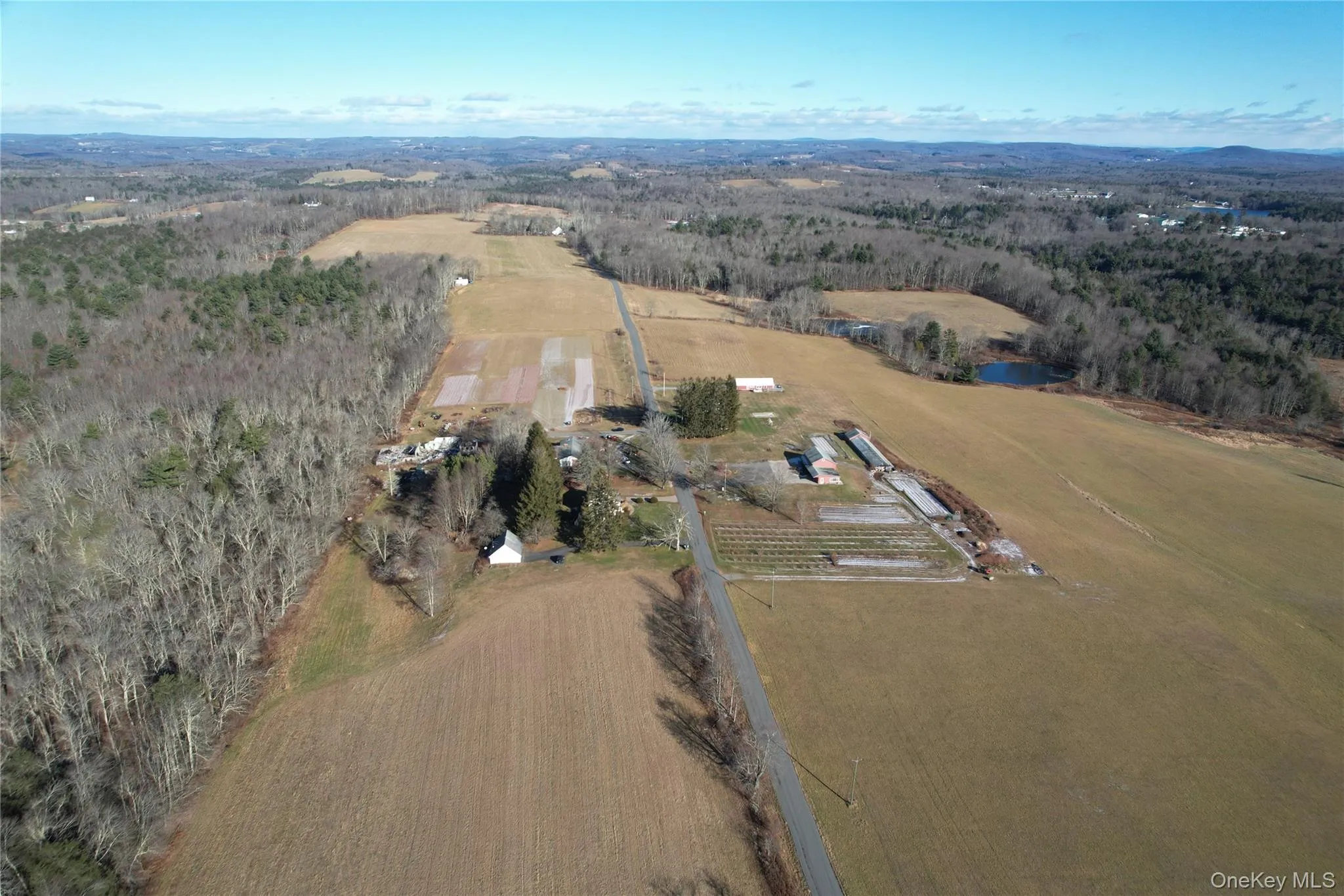 Aerial overview of property's location featuring a heavily wooded area Aerial overview of property's location featuring a heavily wooded area
