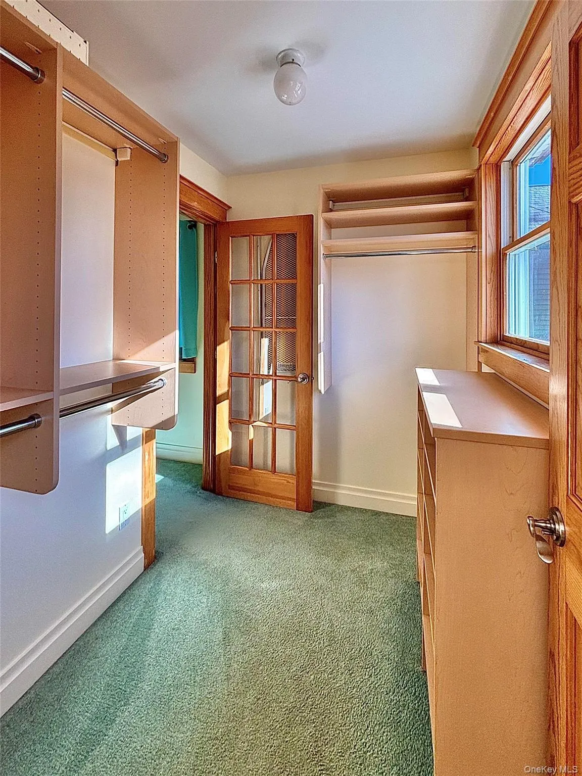 Primary bedroom walk-in closet Primary bedroom walk-in closet