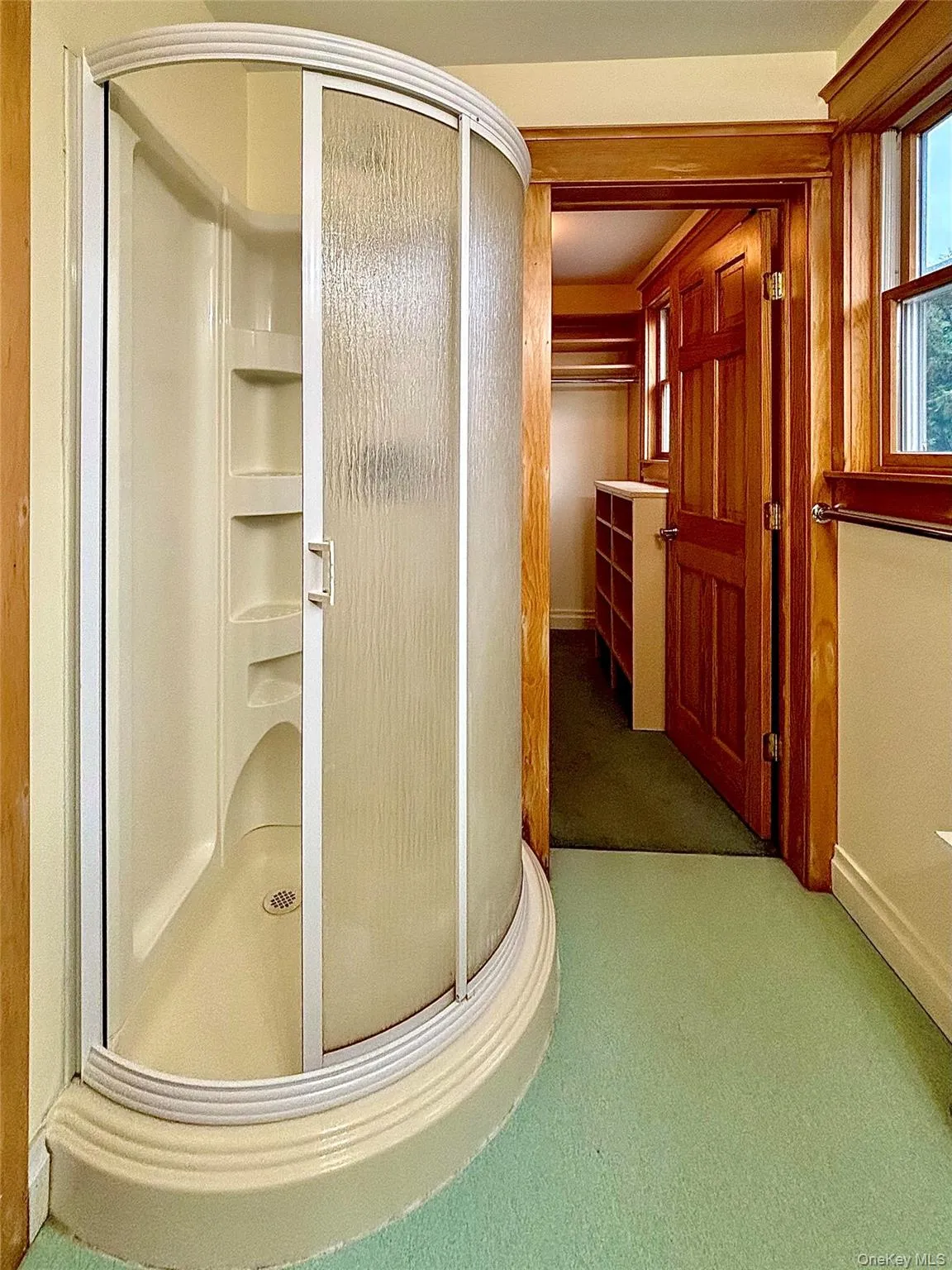 Promary Bathroom with a shower stall Promary Bathroom with a shower stall