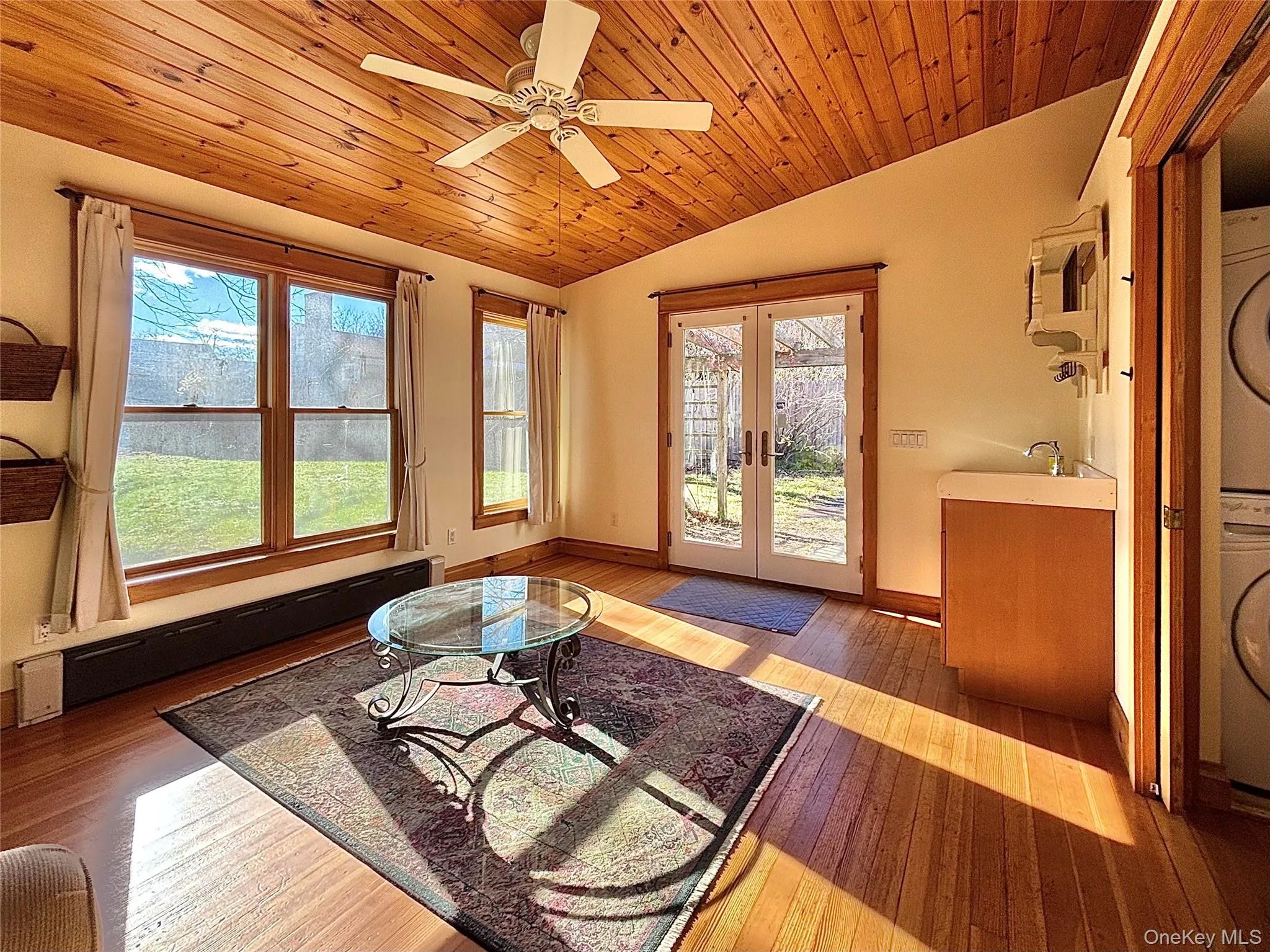 Family/Living room with hard wood floor and vaulted ceiling Family/Living room with hard wood floor and vaulted ceiling