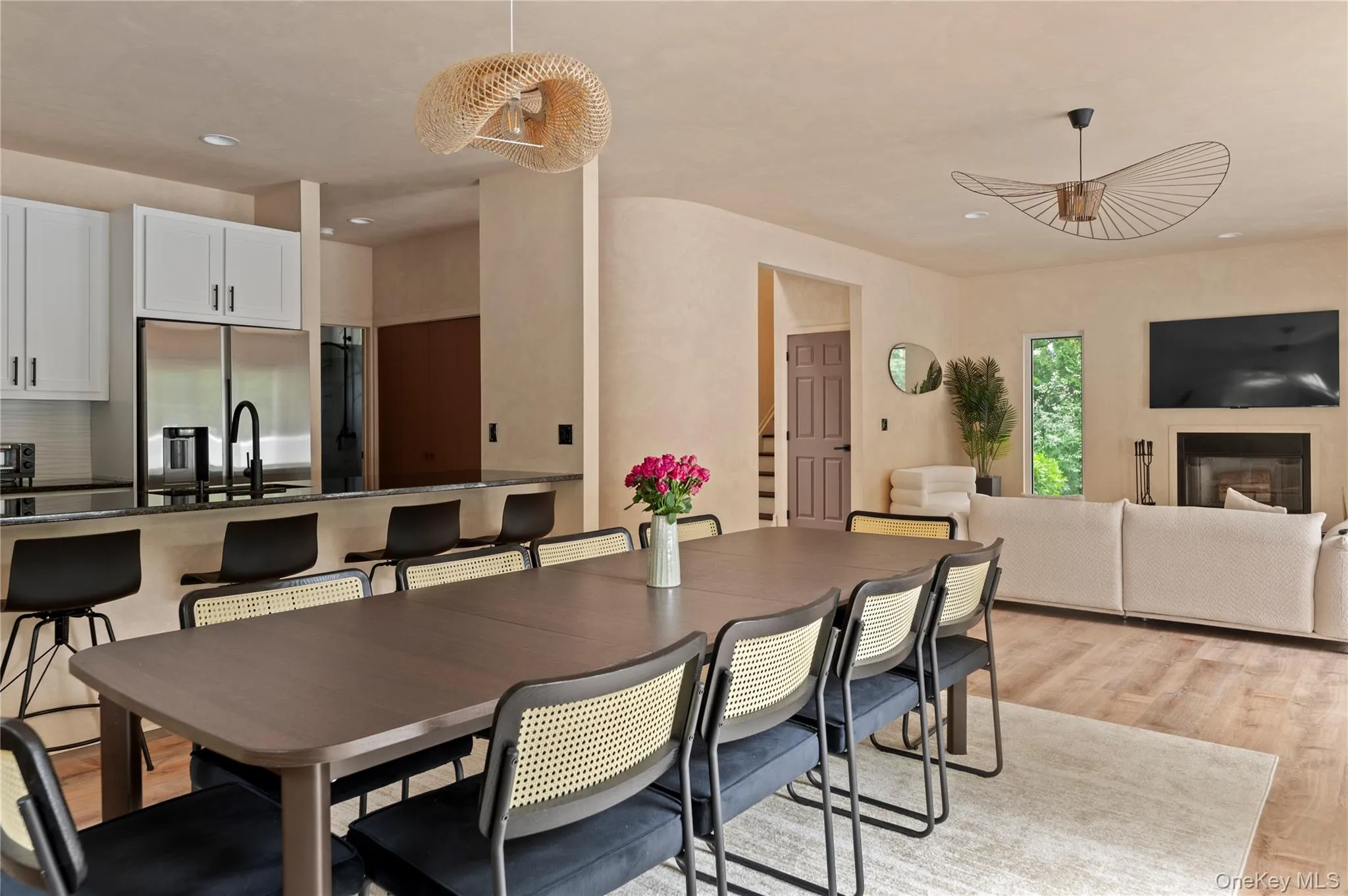 Dining area with recessed lighting and light wood-style floors Dining area with recessed lighting and light wood-style floors