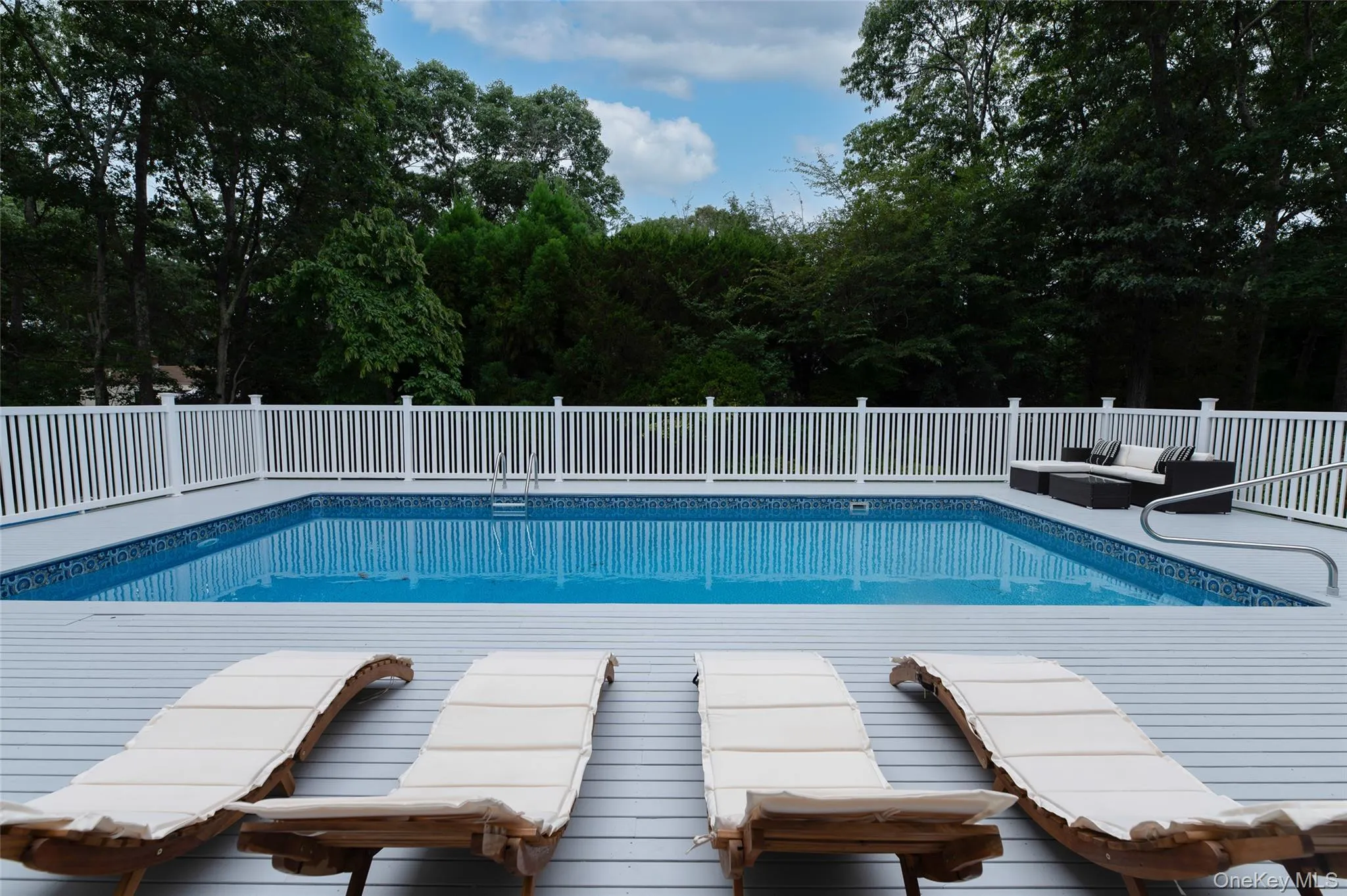 View of swimming pool with outdoor lounge area and a fenced in pool View of swimming pool with outdoor lounge area and a fenced in pool