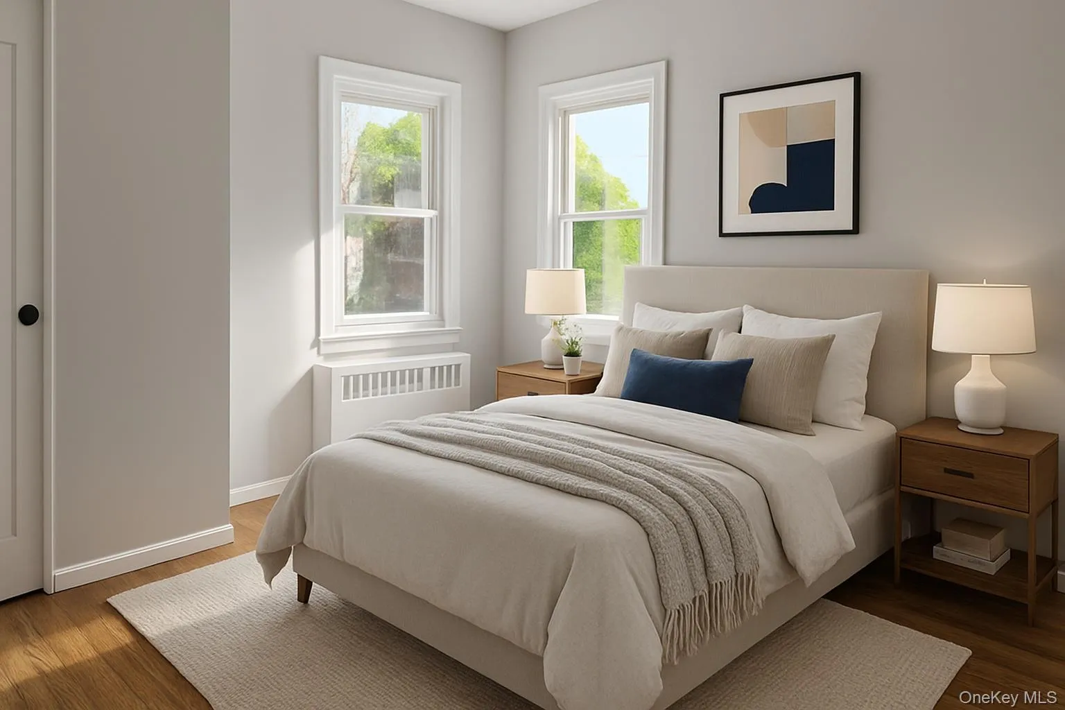 Bedroom featuring radiator and wood finished floors Bedroom featuring radiator and wood finished floors