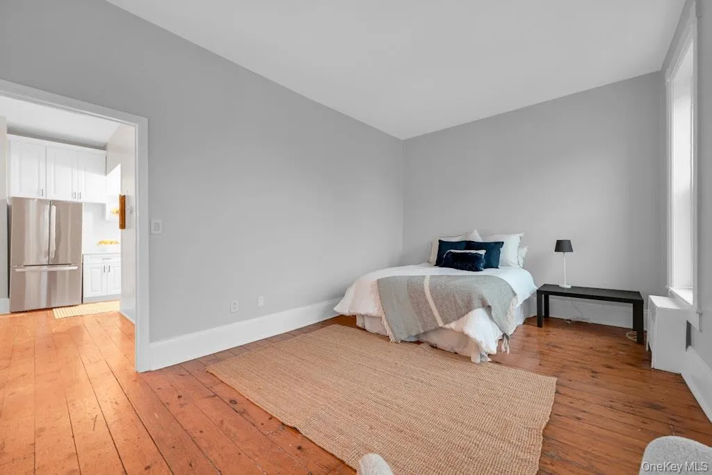 Bedroom with reclaimed wood floors. Bedroom with reclaimed wood floors.