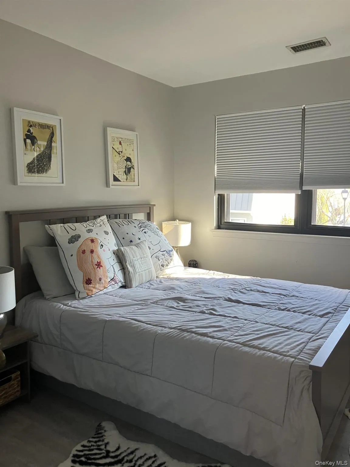 Bedroom featuring wood finished floors Bedroom featuring wood finished floors