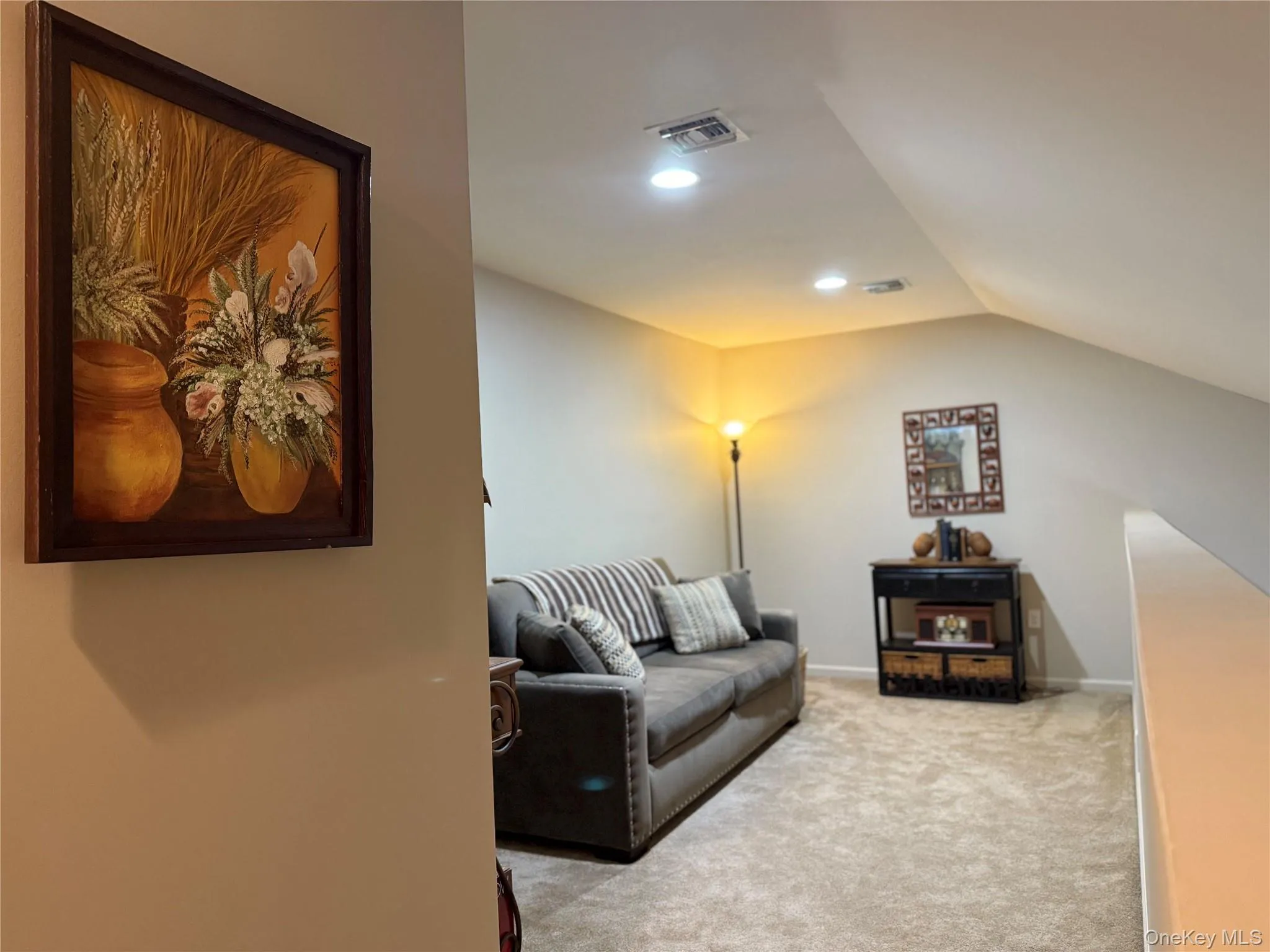 Living area featuring light carpet and recessed lighting. Living area featuring light carpet and recessed lighting.