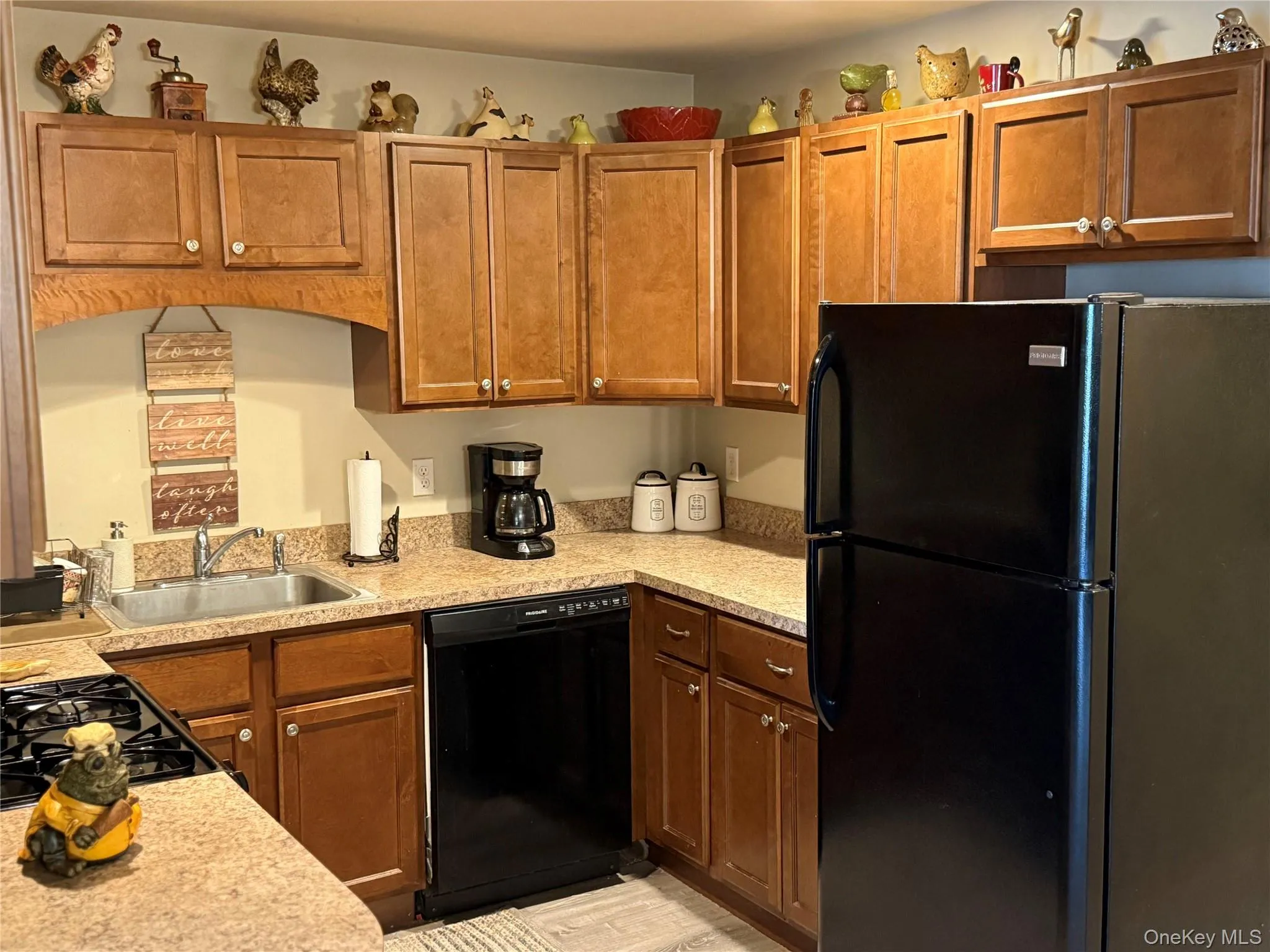 Kitchen with brown cabinetry. Kitchen with brown cabinetry.