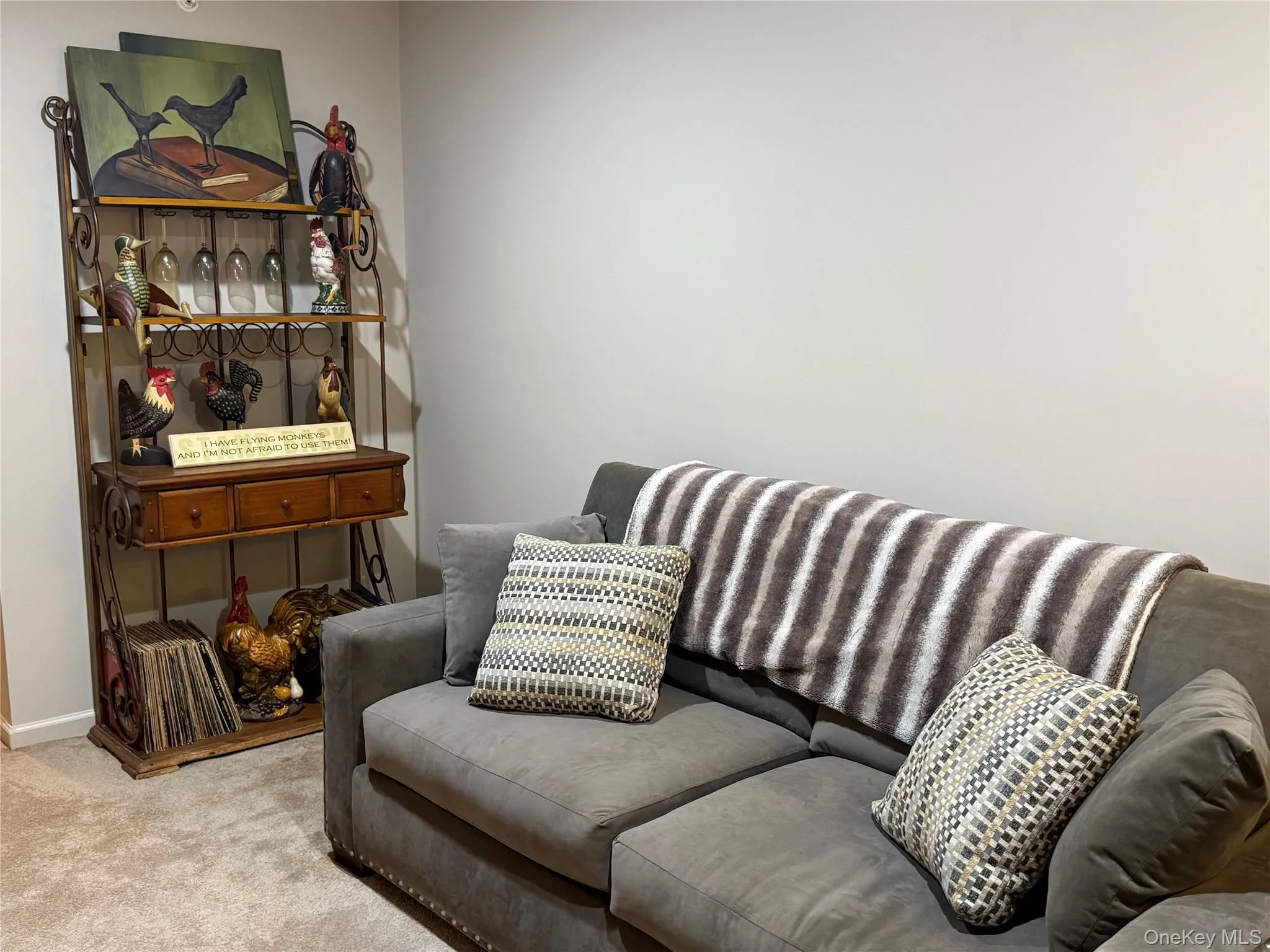 Living area featuring light carpet and recessed lighting. Living area featuring light carpet and recessed lighting.