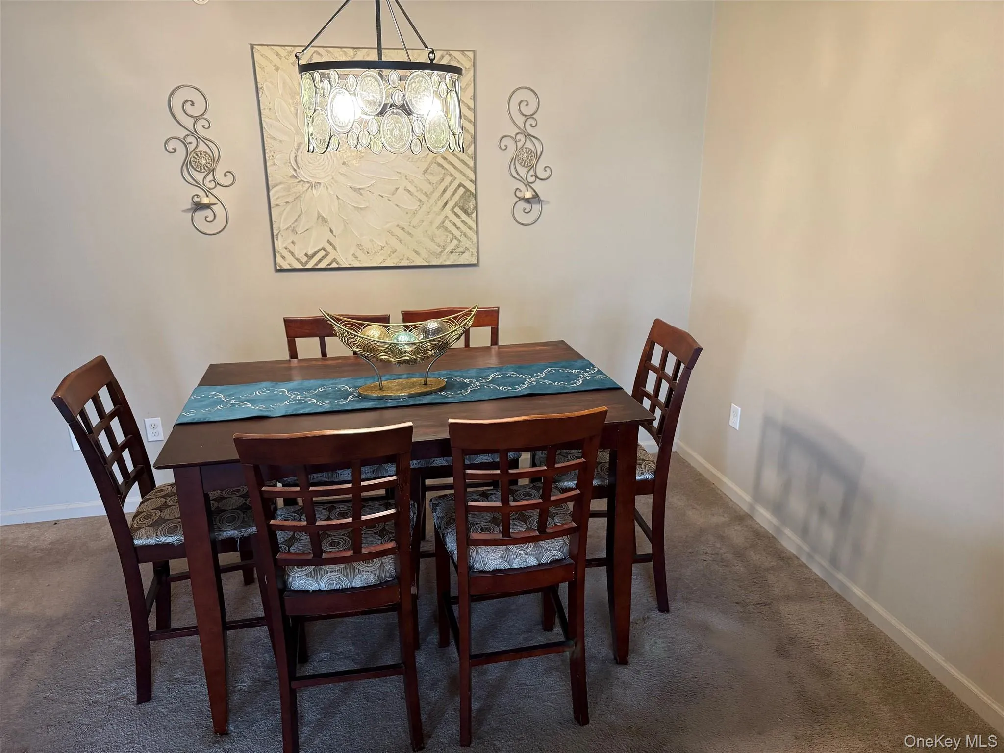 Dining area with dark colored carpet. Dining area with dark colored carpet.