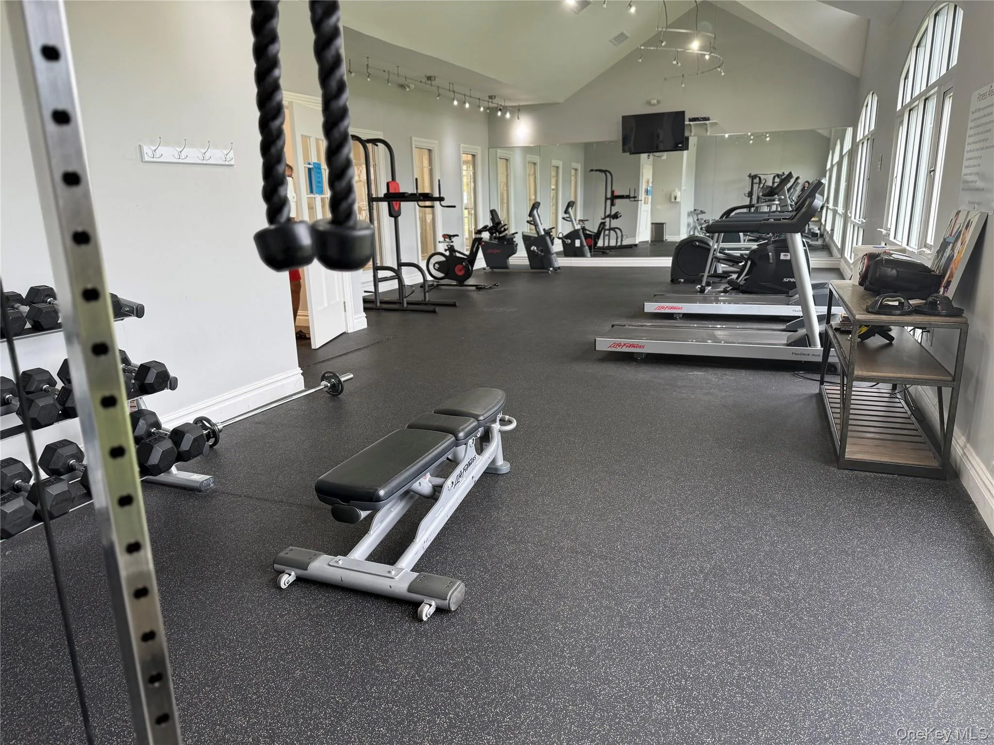 Workout area with high vaulted ceiling. Workout area with high vaulted ceiling.