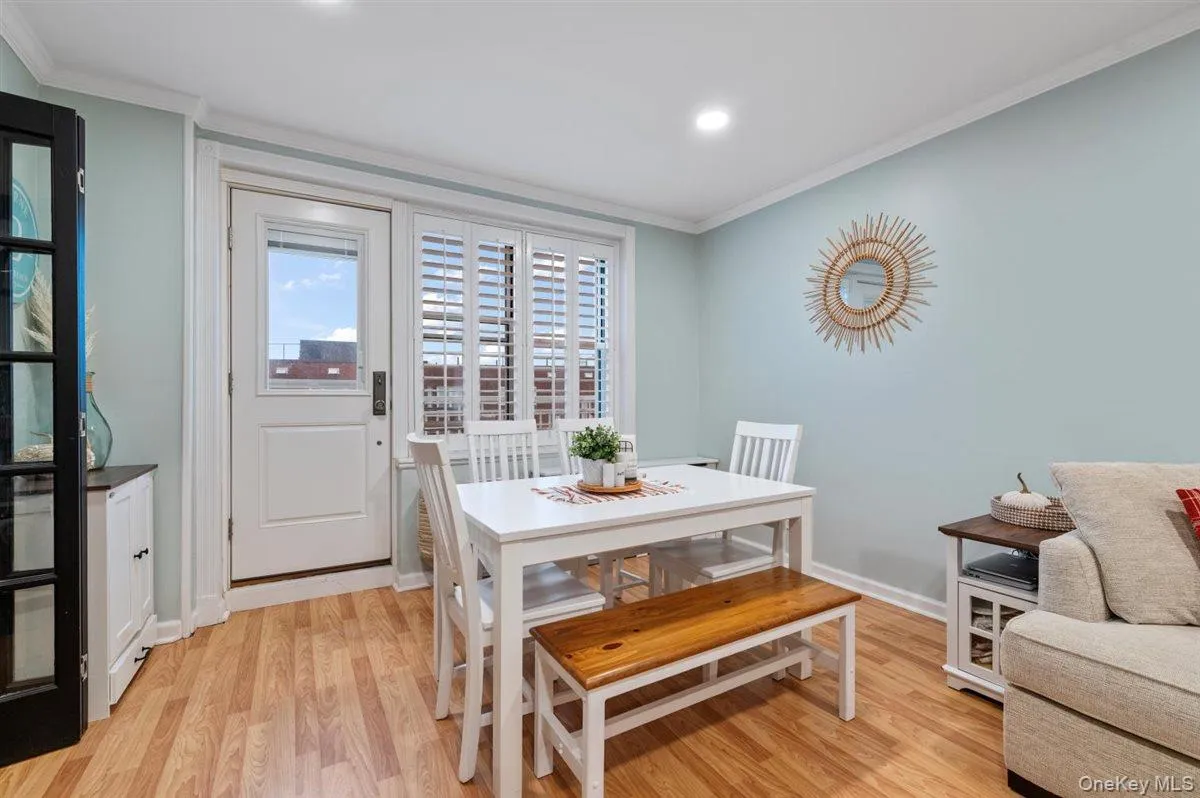 Dining room featuring crown molding, light wood-style flooring, and recessed lighting Dining room featuring crown molding, light wood-style flooring, and recessed lighting