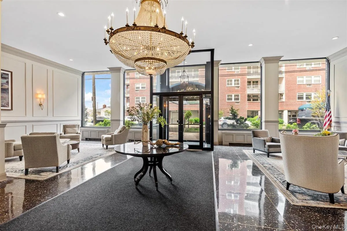 Building lobby featuring a decorative wall and recessed lighting Building lobby featuring a decorative wall and recessed lighting