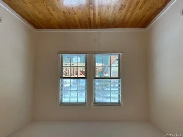 Unfurnished room featuring light wood-type flooring and baseboards Unfurnished room featuring light wood-type flooring and baseboards