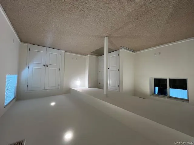 Basement with light carpet and recessed lighting Basement with light carpet and recessed lighting