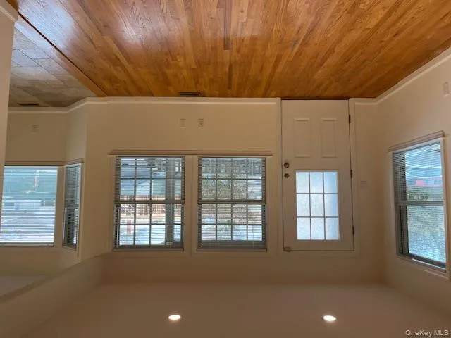 Doorway featuring plenty of natural light, wood finished floors, and recessed lighting Doorway featuring plenty of natural light, wood finished floors, and recessed lighting