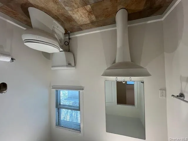 Bathroom featuring baseboards and toilet Bathroom featuring baseboards and toilet