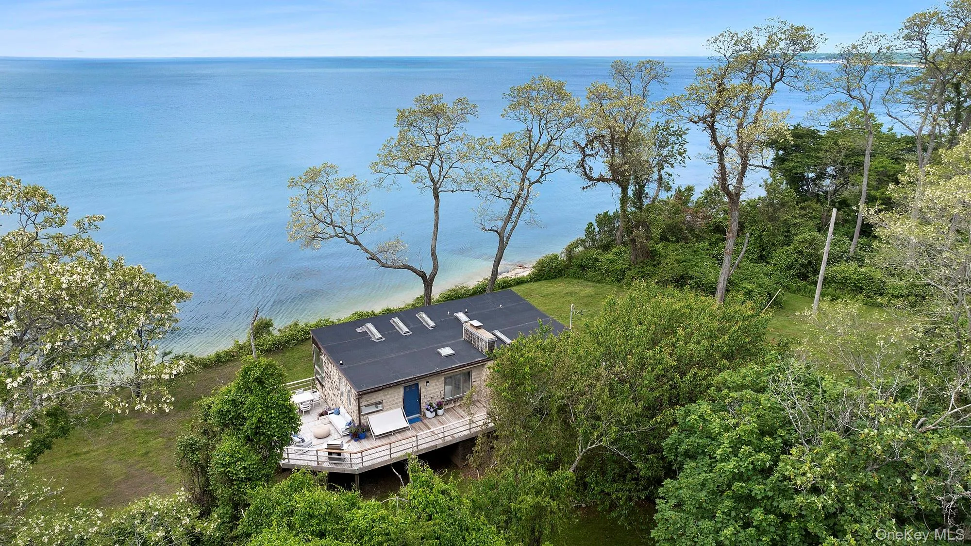 View of subject property featuring a nearby body of water View of subject property featuring a nearby body of water