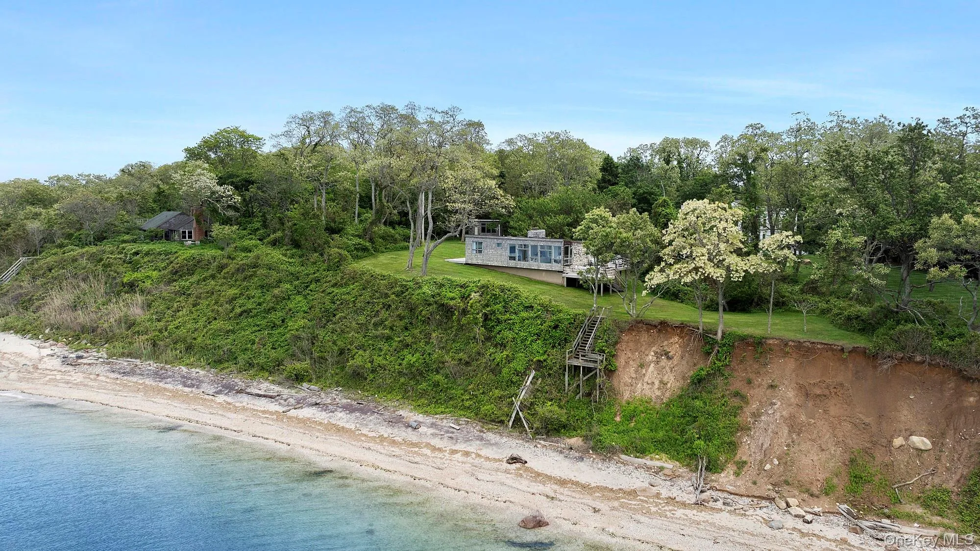 Aerial view of property's location with a large body of water Aerial view of property's location with a large body of water