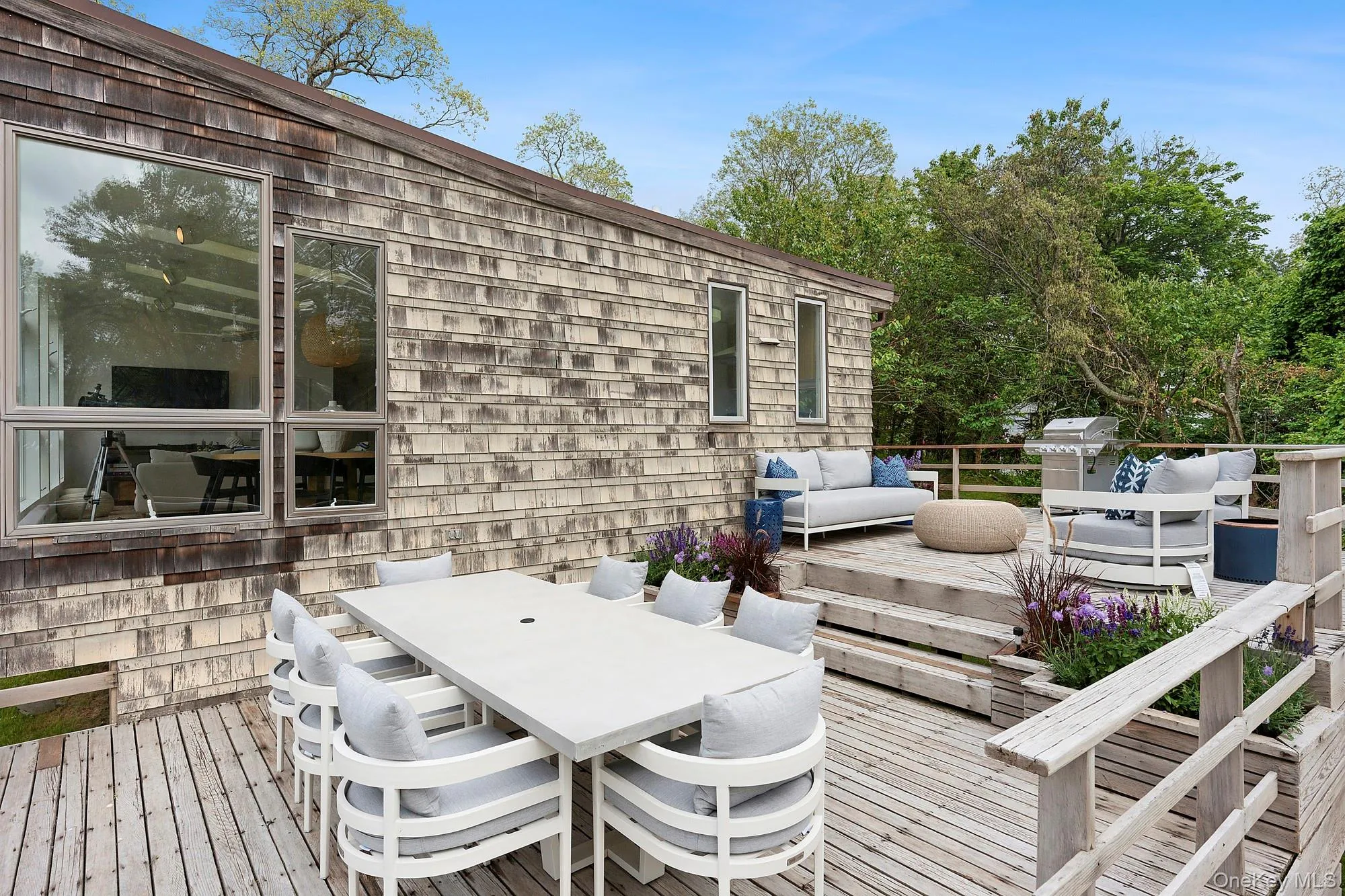 Deck featuring outdoor dining area, a grill, and an outdoor hangout area Deck featuring outdoor dining area, a grill, and an outdoor hangout area