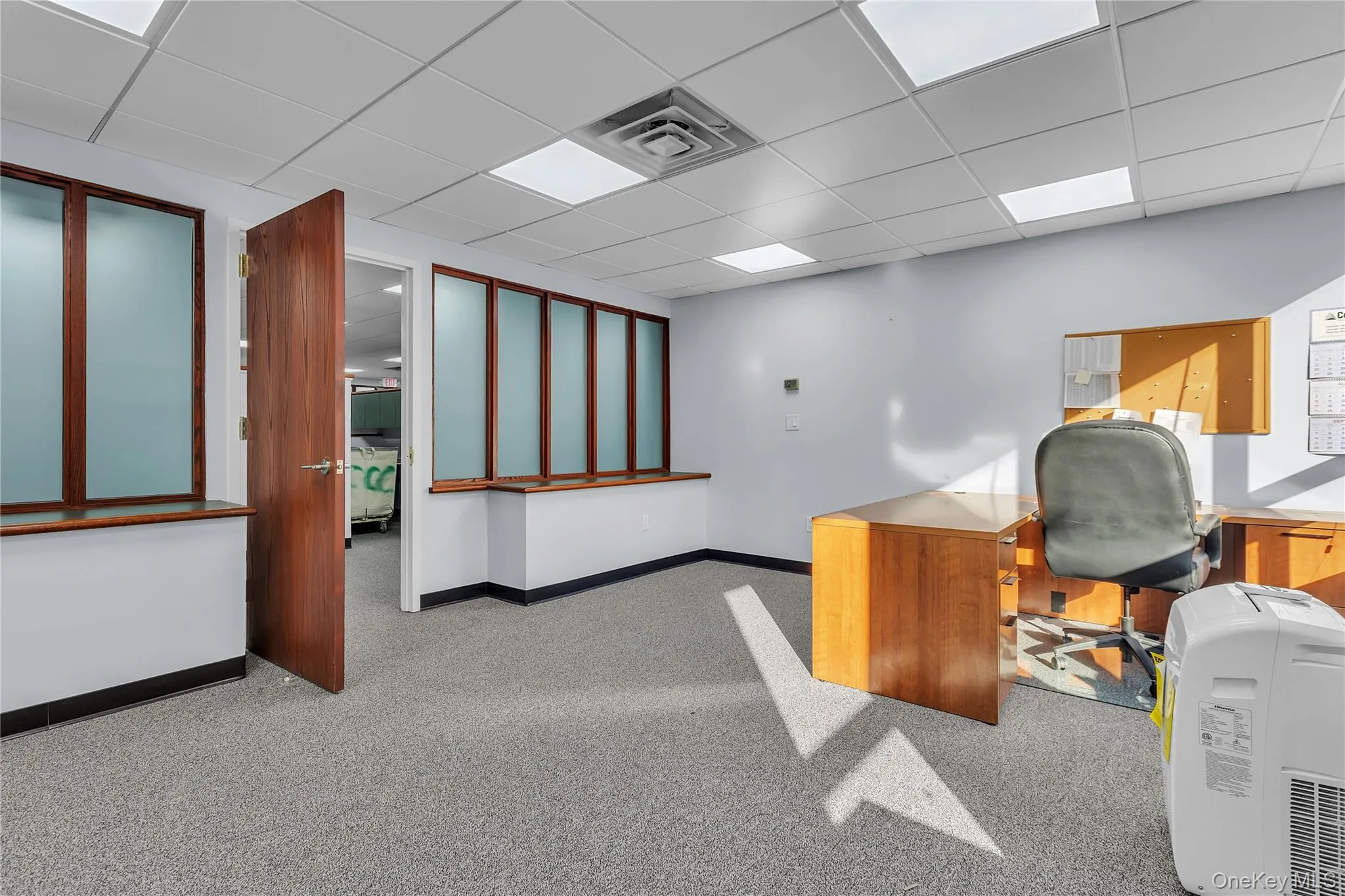 Unfurnished office with a paneled ceiling Unfurnished office with a paneled ceiling