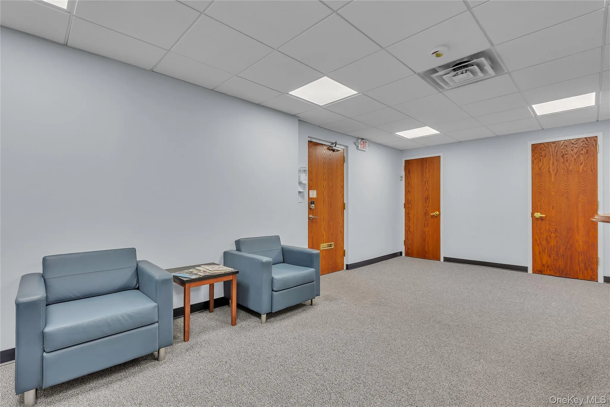 Sitting room featuring a paneled ceiling Sitting room featuring a paneled ceiling