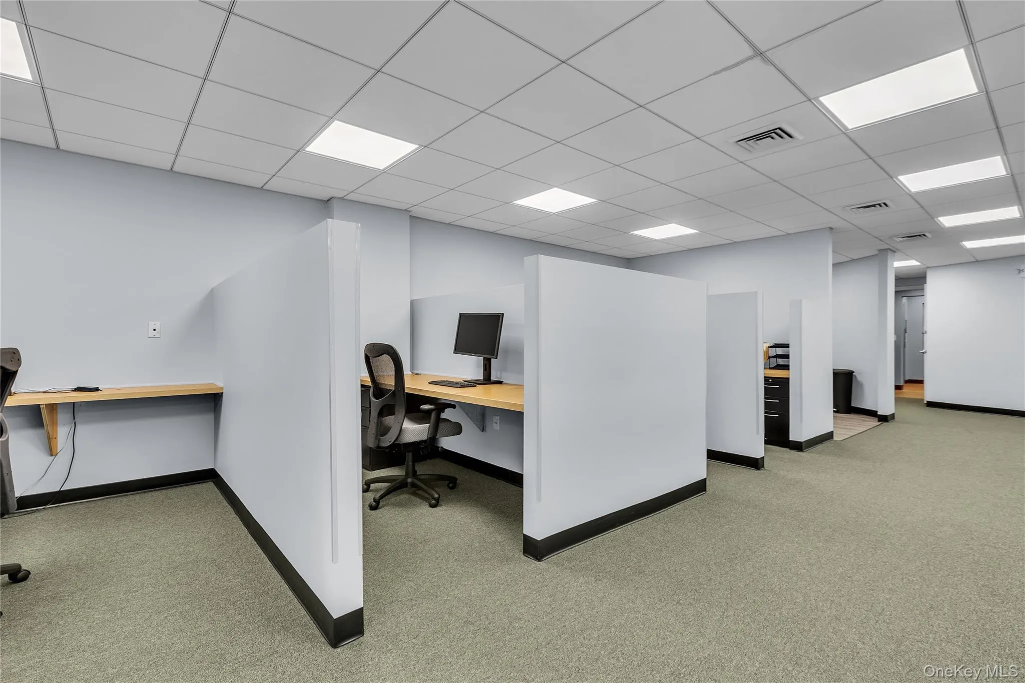 Office area with a drop ceiling Office area with a drop ceiling