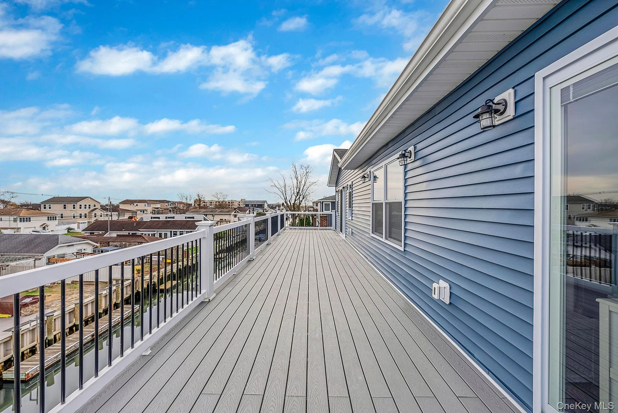 Wooden terrace featuring a residential view Wooden terrace featuring a residential view