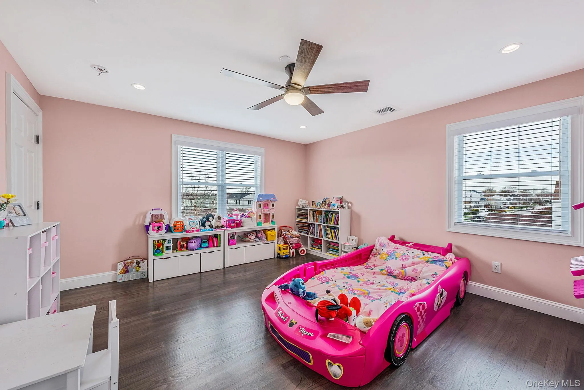 Bedroom featuring dark wood finished floors, a ceiling fan, and recessed lighting Bedroom featuring dark wood finished floors, a ceiling fan, and recessed lighting