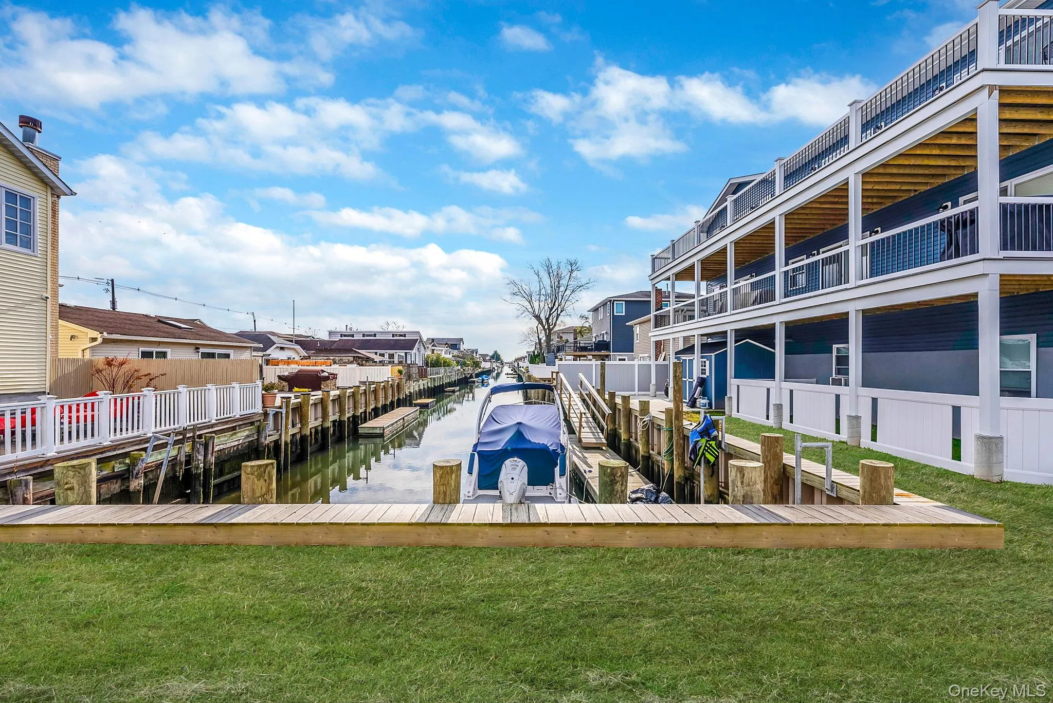 Dock with a yard and a water view Dock with a yard and a water view