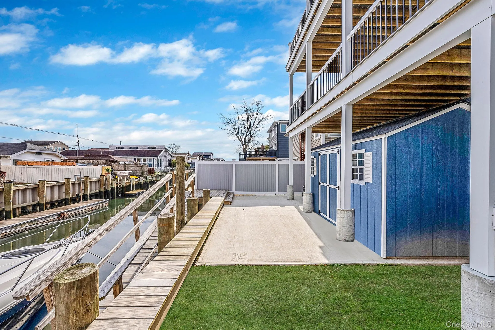 Patio / terrace with a water view and a dock Patio / terrace with a water view and a dock