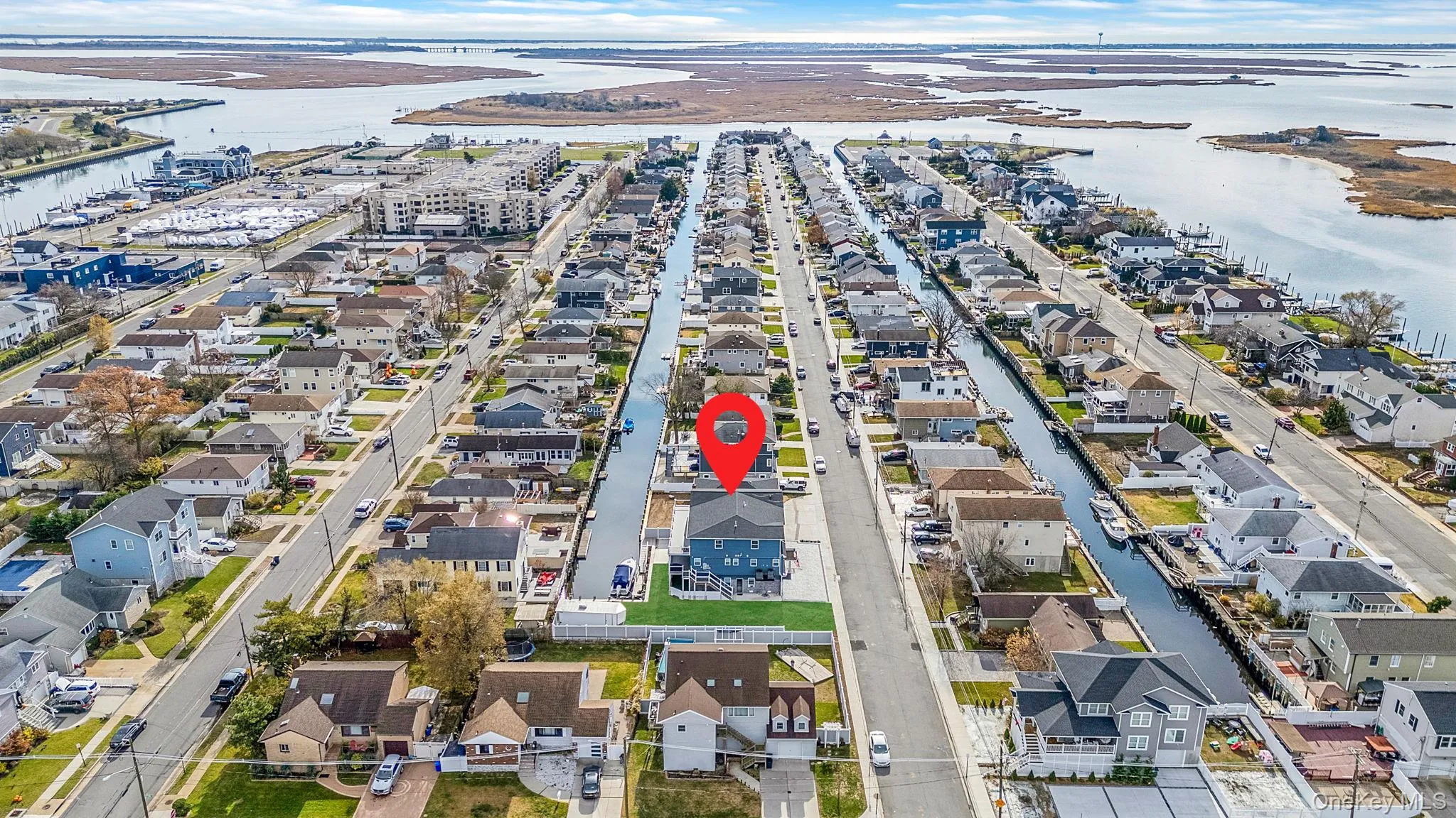 View of property location with a nearby body of water and nearby suburban area View of property location with a nearby body of water and nearby suburban area