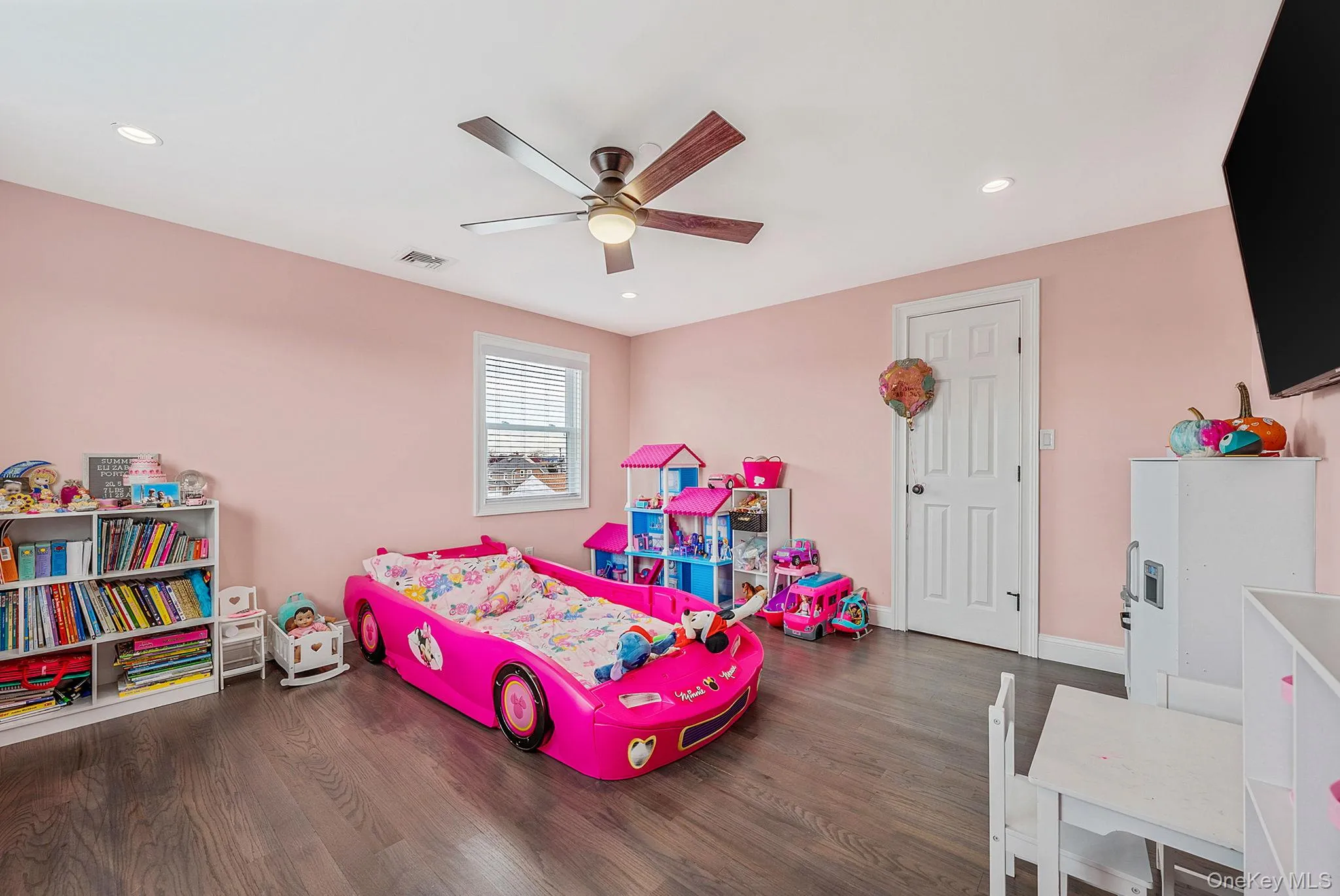 Game room featuring dark wood-type flooring, a ceiling fan, and recessed lighting Game room featuring dark wood-type flooring, a ceiling fan, and recessed lighting