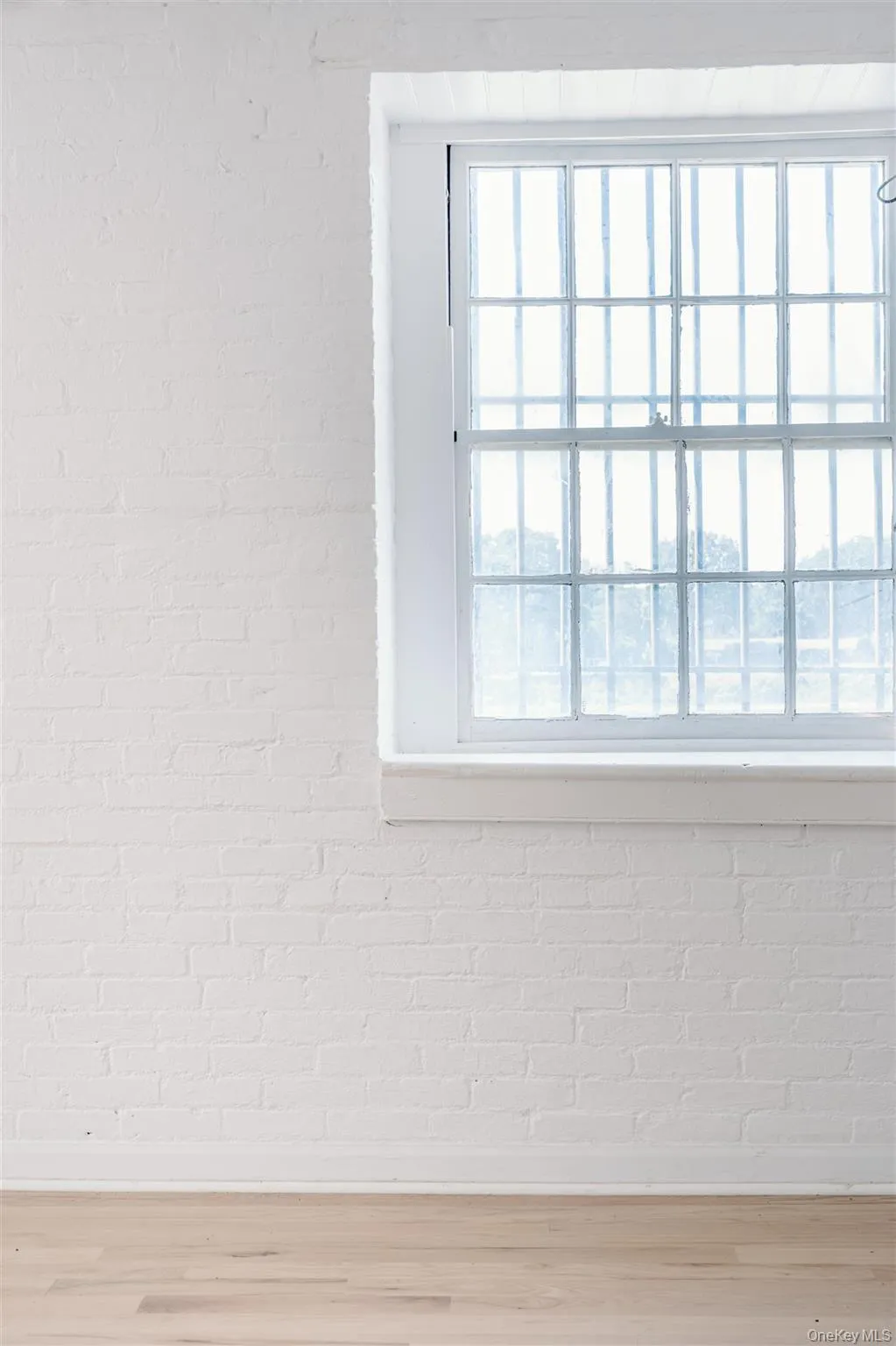 Detailed view of brick wall and wood finished floors Detailed view of brick wall and wood finished floors