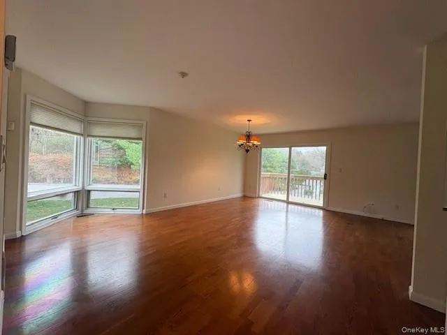 Sun filled living room w/fireplace and dining room Sun filled living room w/fireplace and dining room