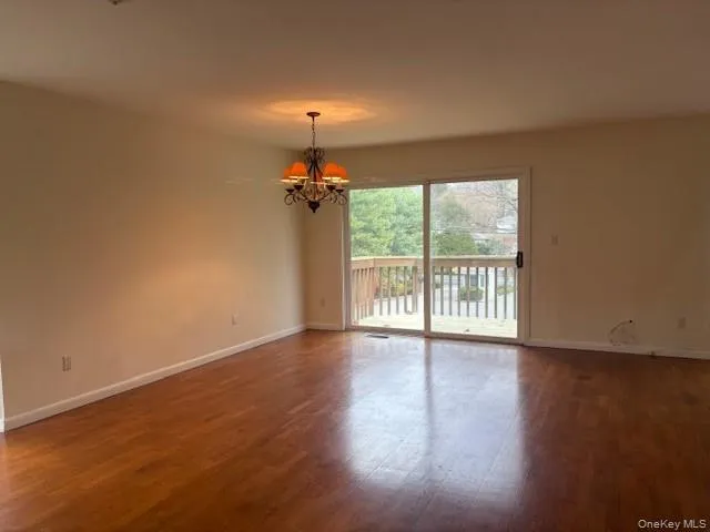 Bright dining area with hardwood floors and access to the deck Bright dining area with hardwood floors and access to the deck