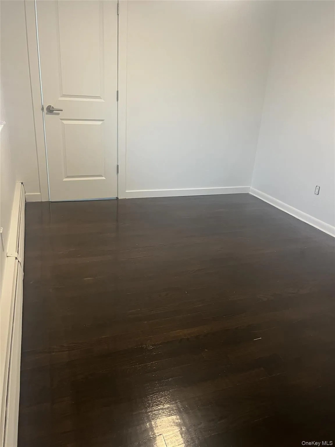 Den room featuring dark wood-style floors Den room featuring dark wood-style floors