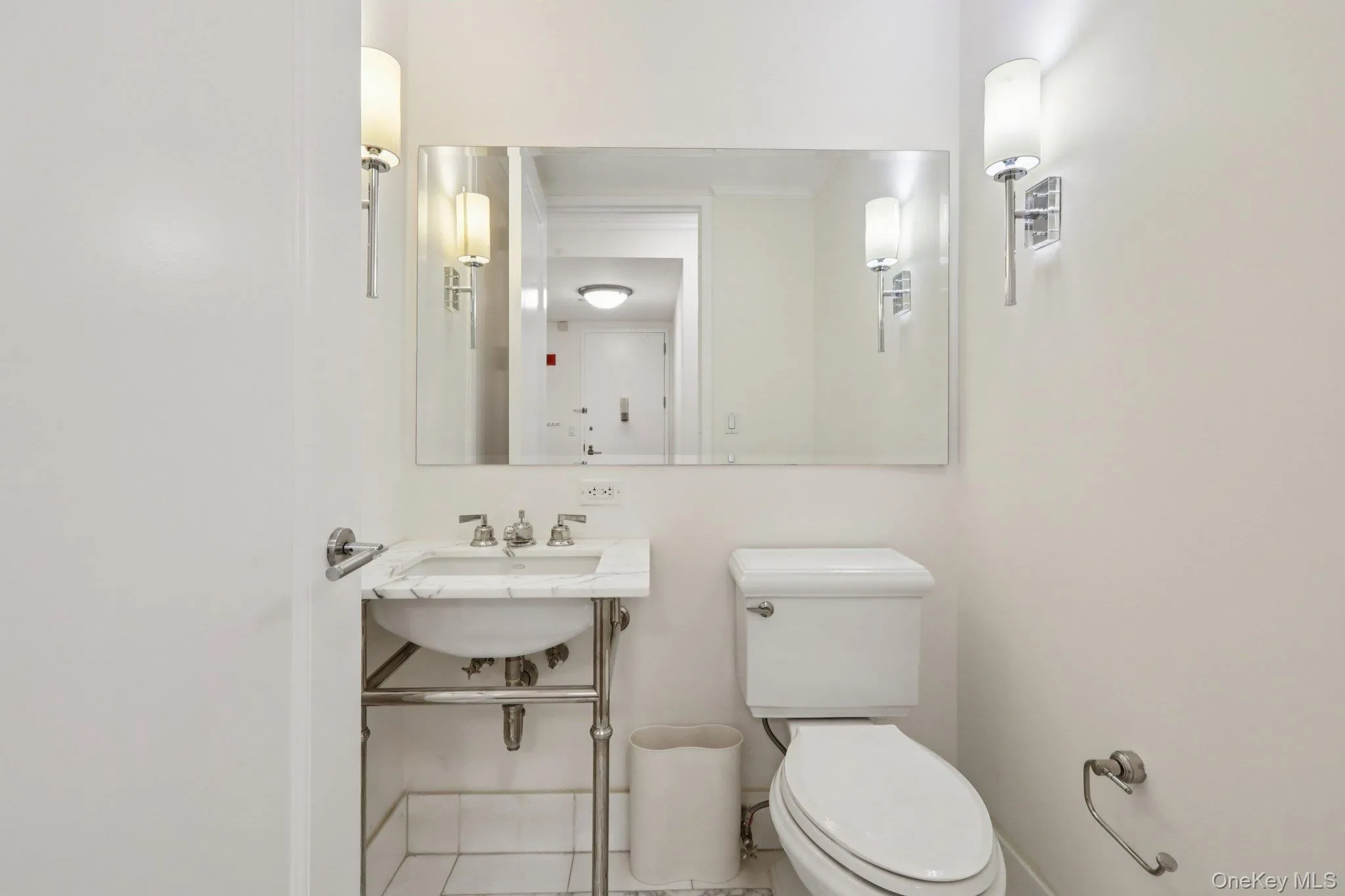 Bathroom with toilet and ornamental molding Bathroom with toilet and ornamental molding