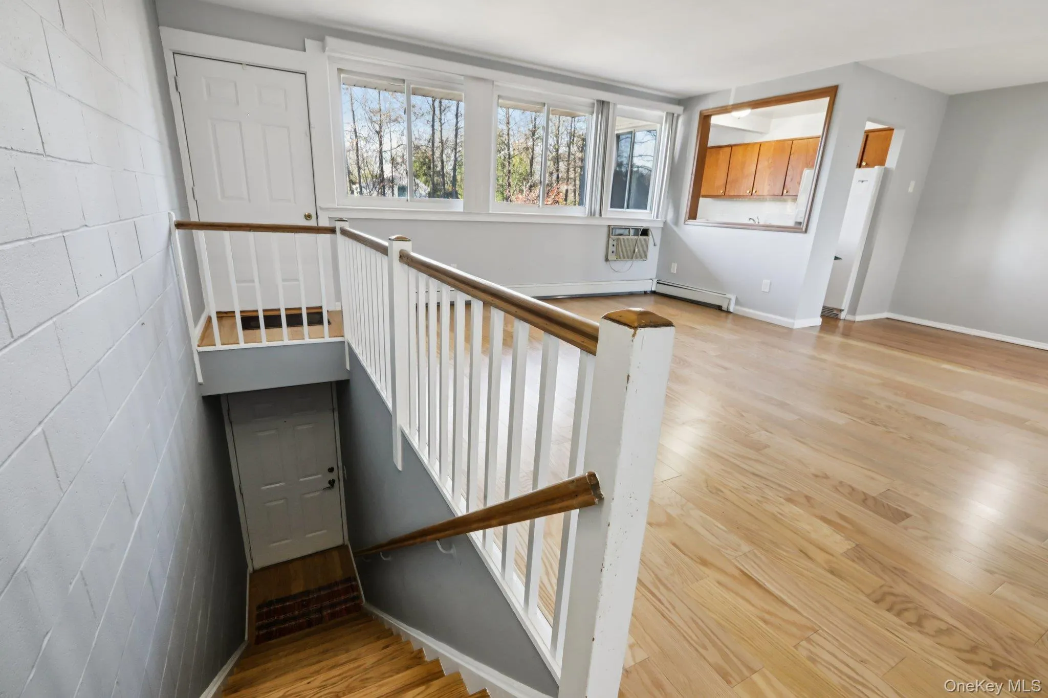 Staircase featuring wood finished floors and baseboards Staircase featuring wood finished floors and baseboards