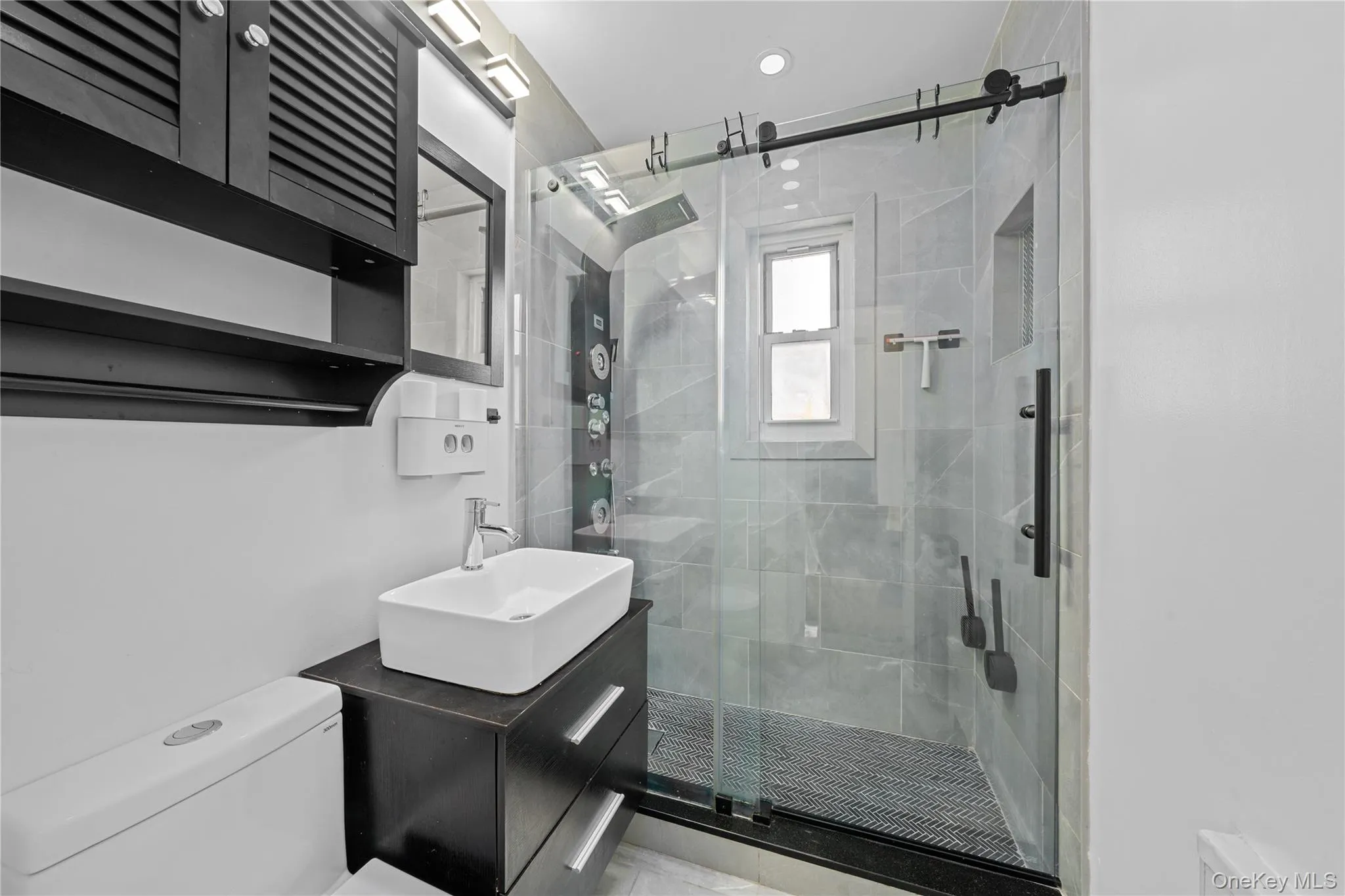 Full bath with vanity and a shower stall Full bath with vanity and a shower stall