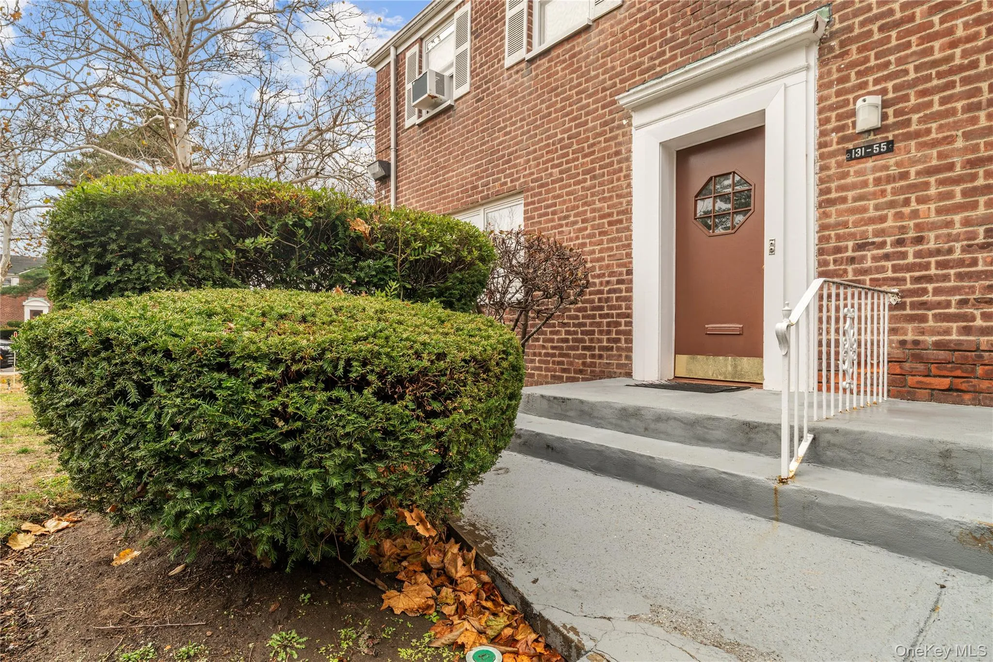 Doorway to property featuring brick siding Doorway to property featuring brick siding