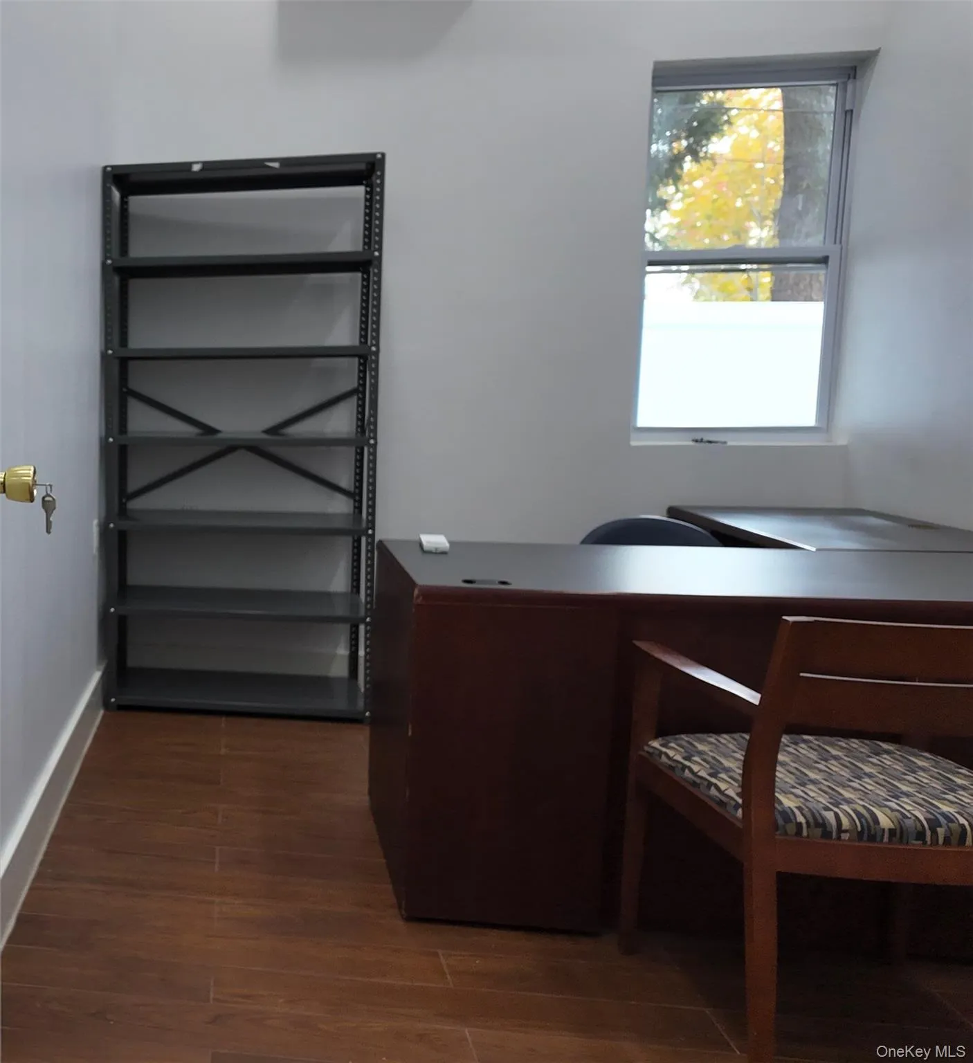 Office featuring dark wood-style flooring and baseboards Office featuring dark wood-style flooring and baseboards